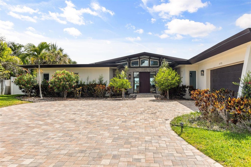 Photo of 4598 Clearwater Harbor Drive S, Largo, FL 33770 (MLS # O6421251)