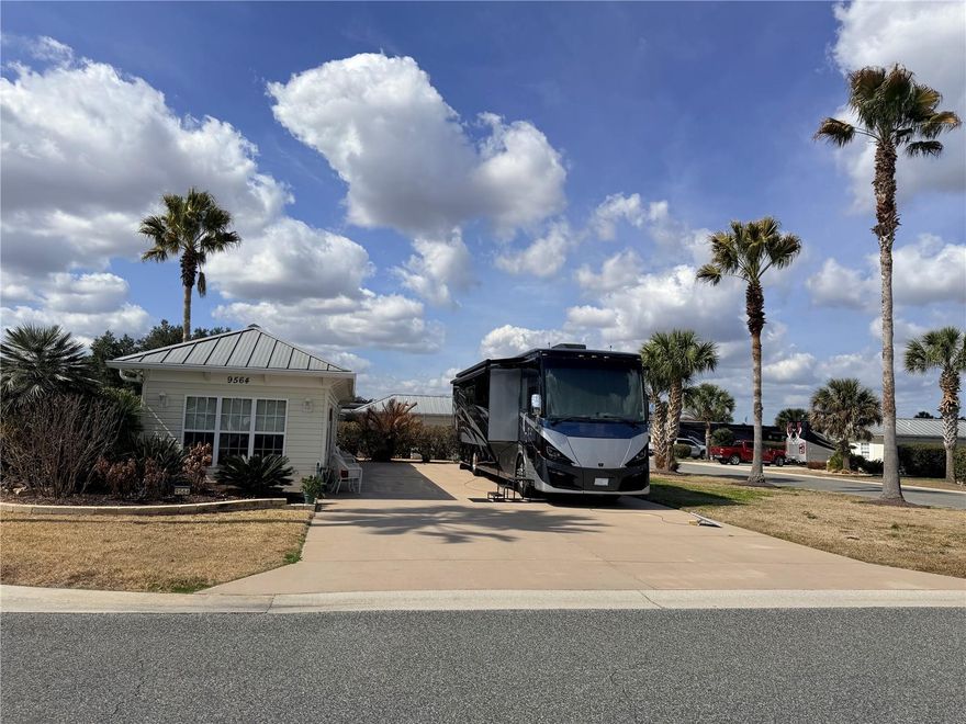 Welcome to Florida Grande Motor Coach Resort and Lot 27—an east-facing back-in on a 
huge 6,987 sq ft corner property with the kind of outdoor living and turn-key comfort that 
makes owning here so special. 
This spacious lot features a 26'x76' concrete pad with full hookups for your motorhome, plus a 
backyard setting that feels like a peaceful Florida escape. Step onto the 12'x16' covered patio 
with a built-in grill and take in the relaxing pasture views with cows and a horse next door. 
Add in the mature palm trees and the spectacular sunsets from the back porch, and you have 
a true “end-of-the-day” retreat. 
Inside, the 384 sq ft Grande Suite comes fully furnished and is move-in ready. The front 
living area is beautifully designed with large windows, built-in bookshelves on both sides, and 
a built-in sitting area across the front window—perfect for coffee, reading, and soaking in the 
Florida sunshine. You’ll also love the upgraded finishes throughout, including cabinetry with 
interior lighting, granite countertops with matching granite windowsills, and elegant details 
like wainscoting, tray ceiling, and Roman window treatments. The suite includes a full 
bathroom with a walk-in shower and glass doors. 
A separate laundry/storage room adds major convenience with a washer and dryer that stay, 
an additional refrigerator, pegboard for organization, multiple shelves for storage, and even 
a built-in wine rack—a thoughtful touch that fits the Florida lifestyle perfectly. 
After you fall in love with the property, you’ll appreciate what makes Florida Grande such a 
sought-after place to own. Known as Florida’s friendliest motorcoach resort, this deeded 
community offers a welcoming atmosphere with a quiet country feel—yet it’s close enough for 
easy day trips and everyday conveniences. Owners enjoy an active social calendar, community 
events, and resort-style amenities, including a beautiful clubhouse and eight brand-new 
pickleball courts that have quickly helped make Florida Grande a true pickleball destination. 
Located in Central Florida, you’re within convenient driving distance to Orlando, Tampa, 
Ocala, and The Villages, making it an ideal home base for exploring, relaxing, and enjoying the 
best of Florida. 
Lot 27 offers space to spread out, a view you’ll never get tired of, and a suite that is ready to 
enjoy from day one—at a resort where community and lifestyle are the main event.