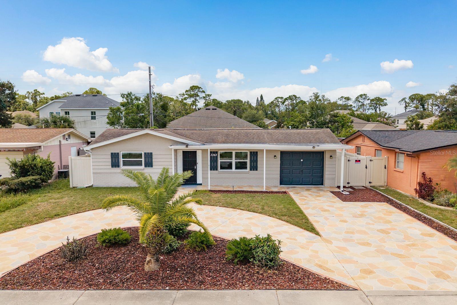 Welcome to this upscale, beautifully remodeled two-bedroom home in the Beacon Square area of Holiday, Florida. This home features solar panels on the roof which are already paid in full. The Sellers estimate their electric bills at just $30/month, even in the summer! You will love the open floor plan in which the kitchen opens to the dining room and living room. This home is move-in ready with updated kitchen appliances and cabinets, bathroom fixtures, flooring, impact windows and an impact-rated sliding glass door. The backyard is completely fenced and includes a spacious screened back patio. The four outdoor patio chairs, outdoor patio table, outdoor grill, and three rain buckets convey with the home. Parking is a breeze with the circular driveway and single car garage. The washer, dryer and two freezers in the garage convey. This home is six miles to the Tarpon Springs Sponge Docks for amazing dining, shopping and sight seeing. It is nine miles to Sunset Beach for swimming in the Gulf. It is five miles to Anclote Village Marina for boating in the Gulf. You also have the option to join the Beacon Square Civic Association for an annual fee to use their swimming pool, game room, gym, playground and other amenities. Schedule your showing now to see this beautiful home.
