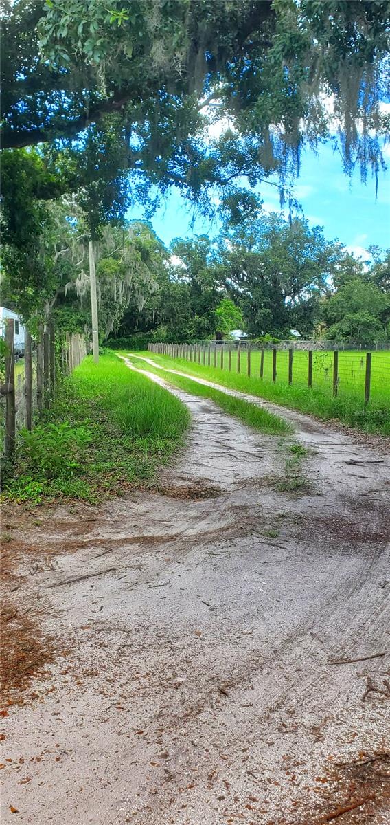 Welcome to 11416 Brahman Road in Lithia, FL, where serene country living meets modern convenience! This charming 3-bedroom, 2-bathroom home offers a rare opportunity for homebuyers seeking privacy, space, and a true sense of tranquility, all without the burden of HOA or CDD fees. Situated on a generous 1-acre lot, this property is zoned for agriculture, providing ample room for your hobbies, toys, and even small farm animals. Imagine the possibilities with no backyard neighbors and ability to fully fenced perimeter, and complete it with a private gate for ultimate seclusion. For RV enthusiasts, this property is a dream come true, offering 50-amp electrical, water, and cable connections, so you can easily park your recreational vehicles, boats, and trailers right on your own land. Easy to tour! Just minutes from FishHawk Ranch & major highways. Only 35–45 minutes from downtown Tampa and 1.5 hours from Orlando. Schedule your private showing today and start envisioning your dream life at 11416 Brahman Road!
