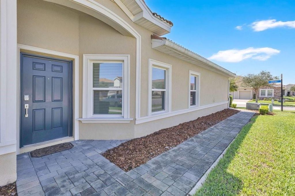 Photo of 1051 Quaker Ridge Lane, Davenport, FL 33896 (MLS # O6390847)