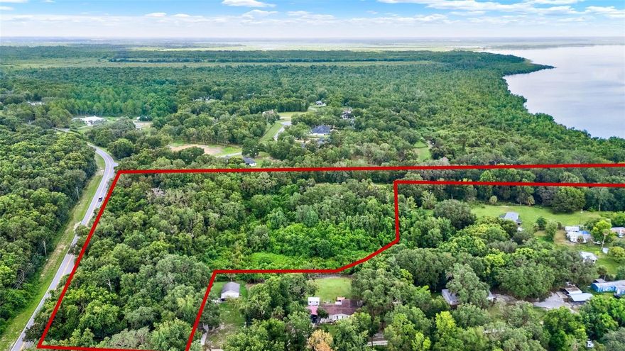 Opportunity Awaits on 10.75 Acres! This unique property features 60 feet of direct frontage on Lake Apopka. Perfect for your future homesite or private retreat, this parcel offers a rare combination of privacy and natural beauty. Approximately 4 acres of the property are wetlands, providing a serene buffer and natural habitat, while the remaining acreage gives you room to create your own vision. A mobile home is currently on-site but holds no value and will need to be removed—leaving you with a blank canvas to develop as you choose. Enjoy the peaceful setting with space to roam, yet remain conveniently located to nearby towns, dining, and recreational opportunities. No HOA. Bring your imagination—and your boots—and come see what makes this property so special!