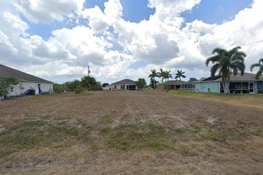 Fantastic opportunity to own residential land in one of Cape Coral’s up-and-coming areas. Whether you’re ready to build your dream home now or looking for a smart investment to hold onto for future growth, this lot offers excellent potential. Enjoy the charm of a growing neighborhood with easy access to schools, shopping, dining, and beautiful Florida beaches. Don’t miss out on this chance to secure your piece of Cape Coral’s bright future!