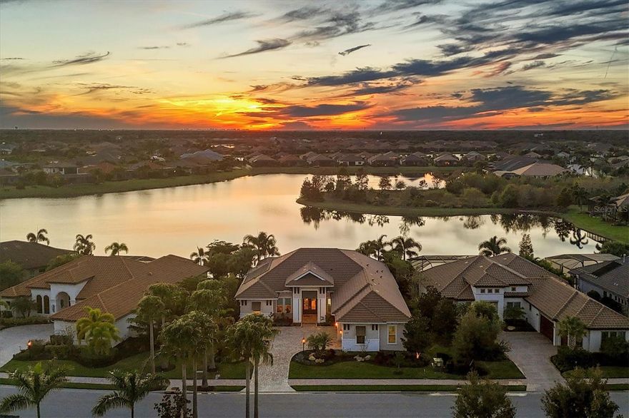 This home qualifies new buyer/seller transfer of Lakewood Ranch Country Club membership without wait list-seller transfers current membership at closing, (all current fee's are applicable to buyer)  Eaglescliffe Lakefront Lee Wetherington  2017 built home with 2022-2023 updates. What a spectacular home with a $$$ view!!!! This home has a western exposure lakefront gorgeous landscape, clearview screened pool/spa/cabana/outdoor pellet grill kitchen/gas fireplace and nearly 1000 sf of spectacular outdoor living space. The new interior features include freshly painted interior, new carpeting in bedrooms,  updated kitchen cabinets, quartzite countertops, designer backsplash, Kitchen Aid appliances including warming drawer, Franke quartz sink, island, dining and foyer lighting, revisions to the master bathroom/the ensuite created for bedroom #2 and remodeled half bath. The oversized 3 car garage with a Florida basement, custom built in Flow Cabinetry work space, bike storage, utility sink cabinet and a mini split AC seal the deal for anyone looking for extra storage or an extension to the inside living. Hurricane Screen System on the rear lanai, Generx Generator, Solar Hot Water Heater,  extended driveway,  and new landscaping make this home scream WOW!  Call today for your private showing of this " BETTER then New" home. Bedroom Closet Type: Walk-in Closet (Primary Bedroom).