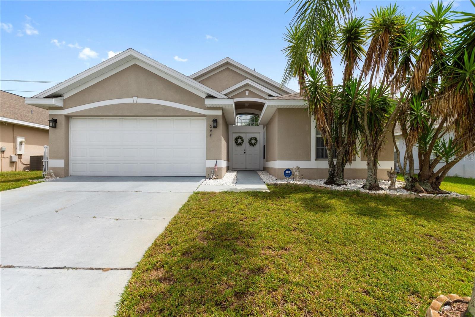 Gorgeous 4 Bed, 2 Bath ONE OWNER POOL HOME located in the desirable Florida Pines subdivision! This home is perfectly situated just off Hwy 27 convenient to everything Davenport has to offer including Publix, Wal-Mart, Lowe’s, and tons of shopping and restaurants! Embrace true Orlando living with an easy drive to Disney, SeaWorld, and Universal Studios! This ONE OWNER home has been well cared for including a NEW ROOF in 2018. When entering the home you’re welcomed by the tasteful updated vinyl wood floors that span throughout the living room and primary bedroom. The living area is spacious with tall vaulted ceilings and easily accessed from all 4 bedrooms, paired with a formal dining area, this is a great place to spend time. The kitchen is near the living area and offers a breakfast nook, tons of counter and cabinet space, and a lovely view over the kitchen sink to the pool deck. Head out to the pool deck through an additional living area, perfect for indoor-outdoor living. The primary bedroom is airy with vaulted ceilings, complete with a large en-suite bathroom with a stall shower, garden tub, and convenient door to the pool deck! Two guest bedrooms are in the front of the home along with a guest bathroom, while the 4th bedroom is located near the primary, great for a bedroom, nursery, office, and more! The EXTENDED POOL DECK is exactly what you’re looking for to enjoy the beautiful Florida weather, with plenty of room for grilling, swimming, and relaxation – a retractable Sunsetter awning also provides great shade to cool off on warmer days. One owner homes like this don’t come up often, schedule your private showing today!