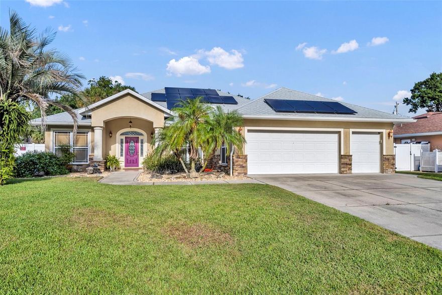 2023 Roof! Beautifully upgraded 3-bedroom, 2.5-bathroom home with a 3-car garage located in desirable Florida Shores. This split floor plan home features a brand-new roof (2023) with solar panels, and a freshly painted interior for a move-in ready feel.

The eat-in kitchen is a chef’s delight with all-new stainless steel appliances and granite countertops, complemented by a formal dining room for entertaining. Enjoy soaring vaulted ceilings and ceiling fans throughout, adding light and comfort to every room.

The primary suite boasts a fully remodeled bathroom (2023) with dual sinks. Step outside to a 15ft x 28ft expanded covered concrete patio complete with a ceiling fan—perfect for relaxing year-round.

The finished 3-car garage is a standout, featuring indoor/outdoor carpeting, built-in cabinetry, extra lighting, ceiling fan, and a hurricane-braced garage door. Additional highlights include a new sprinkler system with water connection, living room powered for surround sound, whole home water softener and more!