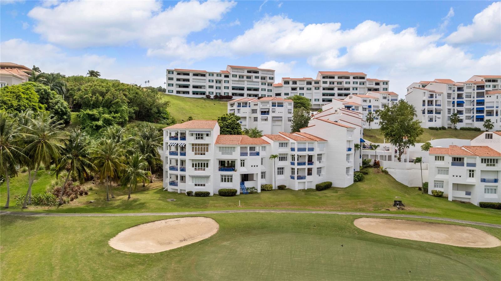 Discover refined tropical living in this fully renovated villa located within the exclusive, double-gated Wyndham RÃo Mar community. Spanning 2,241 sq. ft. over two beautifully designed levels, this residence blends comfort, style, and the tranquility of resort-style surroundings. From the moment you enter, you’re welcomed by abundant natural light and stunning golf course views, visible right from the front door and from one of the villa’s expansive private balconies.
The villa features two spacious bedrooms and three full bathrooms, with the flexibility to easily convert existing space into a third bedroom if desired. On the lower level, where the bedrooms are located, you'll find a second large balcony with direct access to the 7th hole—perfect for golf lovers. The primary bedroom enjoys direct access to this outdoor space, while the second bedroom also connects to it conveniently, offering a seamless indoor-outdoor living experience. The kitchen has been completely redesigned with exceptional attention to detail and top-quality finishes, while the bathrooms have been tastefully remodeled. All interior doors have been upgraded, offering a sleek and modern feel throughout.
It is equipped with two split A/C units and central air conditioning in the kitchen and main living area, as well as electric hurricane shutters in all essential areas. The property is partially furnished with tasteful pieces and includes two deeded parking spaces.
As a resident of this enclave, you will enjoy access to a private pool, and the entire villa community has recently undergone a full exterior renovation, including fresh paint and building upgrades. Additionally, as an owner, you may choose to become a member of the RÃo Mar community, which would grant you access to an array of resort amenities including golf, tennis, beach facilities, and more.
Whether you're looking for a full-time residence, a vacation retreat, or a smart investment, this move-in-ready villa offers an exceptional opportunity in one of Puerto Rico's most desirable coastal communities. Do not miss your chance to own a true gem in RÃo Mar.
