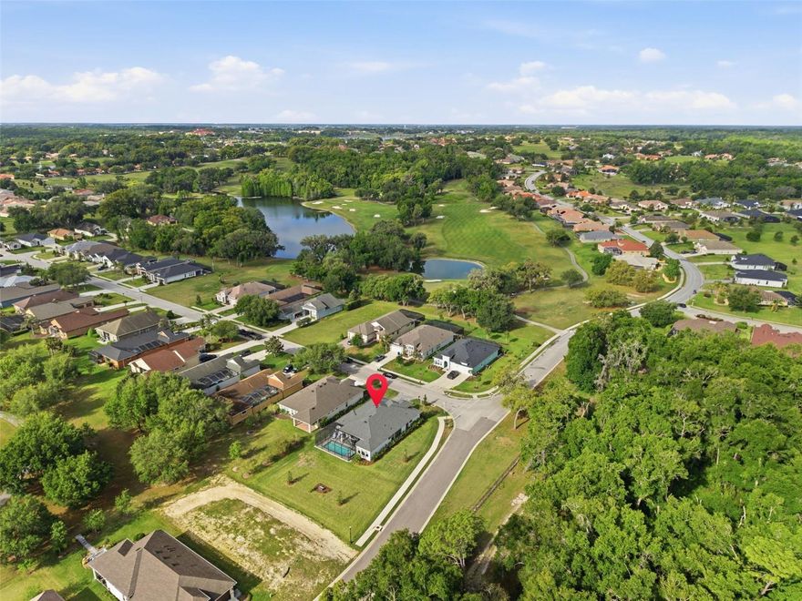 Welcome to one of the most upgraded pool homes currently available in the guard-gated community of Lake Jovita. This 4-bedroom, 3-bathroom home with 2,685 square feet delivers the perfect combination of luxury, functionality, and resort-style outdoor living.

From the moment you walk in, you’ll notice the attention to detail with decorative molding, a custom office accent wall, and ceiling fans throughout. The kitchen is a true standout, featuring GE Café smart appliances including a double oven and built-in convection oven with air fryer, upgraded upper cabinets with glass doors, and stylish pendant lighting, all opening seamlessly to the main living space.

The primary suite offers a high-end feel with a custom closet system and a spa-inspired bathroom highlighted by a freestanding soaking tub. The versatile fourth bedroom includes barn doors and built-in surround sound, ideal for a media room, office, or guest suite.

The outdoor space is where this home separates itself from the rest. Enjoy a heated private saltwater pool and hot tub, an extended lanai, and a fully screened panoramic enclosure designed for year-round enjoyment. Major functional upgrades including a French drain system and pool overflow system provide added value and peace of mind.

Additional features include a hardwired alarm system, pre-wiring for security cameras, a whole-home water treatment system, and overhead garage storage.

Located in Lake Jovita, residents enjoy access to two 18-hole championship golf courses and multiple optional membership tiers, offering a true country club lifestyle without sacrificing privacy.

Homes with this level of upgrades, outdoor living, and location do not come available often. Schedule your private showing today.
