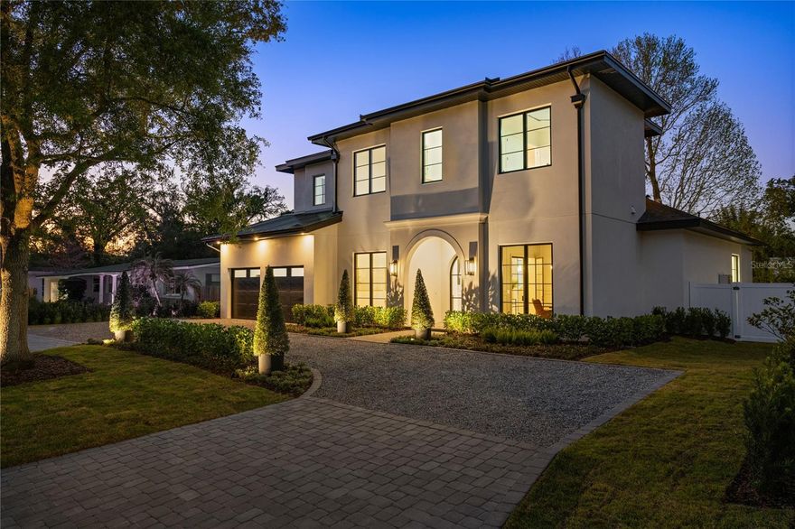 Located in the heart of Winter Park this exquisite modern residence built by Vimaro Homes features almost 5,000 square feet of luxury living space. As you step through the glass front doors, you’re immediately greeted by the grandeur of the marble entry floors and custom archways, setting the tone for the exceptional finishes throughout this stunning home. From the gorgeous wood floors laid in a herring bone pattern, to the designer light fixtures, arched doorways, and beautiful mill work, no expense was spared in the construction of this remarkable residence. The chef’s kitchen features exquisite custom cabinetry, marble countertops, a massive butler’s pantry, top of the line appliances including a ILVE Nostalgie range, and a wine cellar. The great room features a wall of glass that opens to the spacious covered lanai blending the indoor and outdoor spaces. The primary bedroom suite overlooks the private back yard and features a spa bath that would rival even the most prominent spas. Last but not least there is a massive walk in closet with separate his and hers sections, and a washer and dryer. Additional features include a first-floor game room, home office, formal dining room, a second floor loft area, 4 additional bedrooms, and second floor laundry room. Situated on a spacious lot, this property features a circular driveway, and a large, fenced yard with mature landscaping, perfect for outdoor activities and entertaining. The highlight of this home is the inviting pool, providing a refreshing oasis for those hot summer days. Jump on your golf cart and within minutes you’re transported to Park Ave, with its amazing shops, fine dining, and everything else that Winter Park has to offer. Don’t miss your opportunity to own this stunning Winter Park home crafted by renowned builder Vimaro Homes.