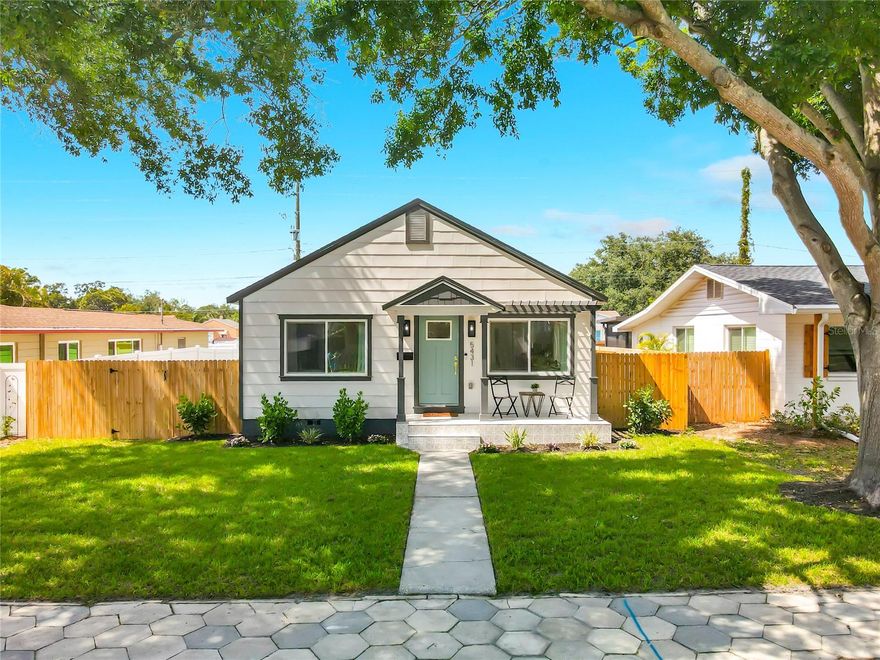 Fully Renovated Live Oak Craftsman | NON-FLOOD ZONE | Designer Finishes + Major Upgrades

Nestled in the charming and highly desirable Live Oak neighborhood, this fully renovated home offers a rare combination of style, efficiency, and peace of mind. From the moment you arrive, you’ll be drawn to the inviting front porch featuring decorative tile, custom pergola, fresh landscaping, and beautifully updated Craftsman-style curb appeal.
Thoughtfully reimagined, this 3-bedroom, 2-bathroom home offers 1,155 square feet of bright, open living space filled with natural light, waterproof luxury vinyl plank flooring, and energy-efficient LED lighting throughout.
The designer kitchen has been beautifully updated with Venatino Carrara quartz countertops, custom two-tone soft-close solid wood shaker cabinetry, premium stainless steel appliances, and a stylish tile backsplash that creates a clean, modern aesthetic. The open-concept living, kitchen, and dining areas flow seamlessly together, creating the perfect space for relaxing or entertaining.
The spacious primary suite serves as a true owner’s retreat, complete with a spa-inspired en-suite bathroom featuring a soaking tub, oversized walk-in shower with custom niche, dual-sink vanity, porcelain tile, quartz countertops, and oversized rain shower heads with handheld sprayer. Two additional bedrooms are bright and welcoming, while the guest bathroom features a beautifully finished shower/tub combination with matching designer finishes.
What truly sets this home apart are the extensive system upgrades that provide long-term value and buyer confidence, including a new roof, impact-rated windows and doors, updated HVAC system, new ductwork and insulation, tankless water heater, all-new electrical including panel, and all-new plumbing with updated drain lines to the alley and new supply lines to the meter.
French doors off the dining area lead to a custom-built deck and a fully fenced oversized backyard designed for both entertaining and functionality. The alley-access double gate provides a secure space for boat or RV parking, additional vehicles.
Additional features include a dedicated laundry closet with new LG stackable washer and dryer and a double driveway for off street parking.
Located in a NON-FLOOD ZONE and just minutes from downtown St. Petersburg, award-winning beaches, shopping, dining, parks, and both airports, this fully permitted, move-in-ready home delivers the ideal blend of modern design, quality craftsmanship, and everyday convenience.
If you’ve been waiting for a home that truly stands above the rest, this is the one.