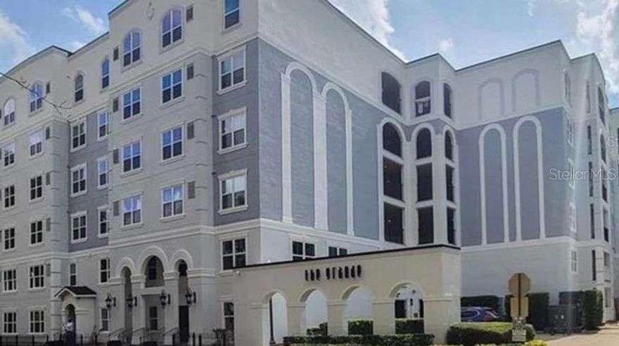 Welcome home to this well maintained 2 bedroom 2 bathroom 4th floor unit that overlooks the beautiful pool!  This 1115 sq ft condo features a split floor plan with a primary bedroom and ensuite with a walk-in closet.  The open kitchen features newly refinished white cabinets, stainless steel appliances and a washer and dryer.  The guest bathroom seamlessly connects to the guest bedroom.  Wood, vinyl and ceramic tile throughout.  The Grande Downtown is located across the street from Dr. Phillips Performing Arts.  Walk to Lake Eola, Restaurants, Publix, bars and more!