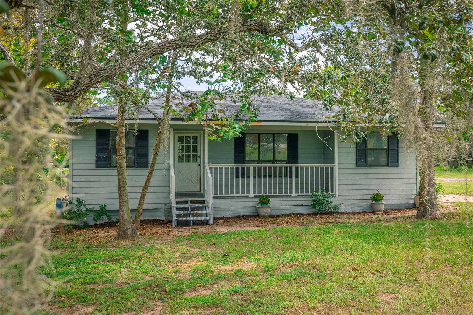 Charming Country Retreat in Shady Hills – 3 Bed, 1 Bath on 1.25 Acres!
Tucked away in the peaceful agricultural area of Shady Hills, this charming 3-bedroom, 1-bathroom manufactured home offers the perfect blend of rural tranquility and modern convenience. Situated on 1.25 fully fenced acres, this property is ideal for animal lovers, hobby farmers, or anyone looking to enjoy the privacy of country living just minutes from the city.
Step inside to find a warm, welcoming home with recent updates including a brand new roof, 2024 HVAC system, 2024 refrigerator, and a new well pump (2024). A high-end water softener system ensures quality water throughout the home. Enjoy your mornings or evenings relaxing on the covered front and rear porches.
Outside, the property is ready for all your outdoor living needs. Cross-fenced with no-climb horse fencing, featuring 2 paddocks — perfect for horses or livestock. A chicken coop adds a touch of homestead charm. Cool off in the 15x30 above-ground pool with a new 2024 pool pump and surrounding wood deck. The oversized 2-car detached garage includes a fitted workbench, full electric, and even a built-in area with sink and urinal — all sitting on a solid concrete slab, ideal for a workshop, hobby space, or storage. Enjoy the best of both worlds — peaceful, off-the-beaten-path living, yet just down the road from the Suncoast Parkway, making commutes a breeze. You're minutes from parks, restaurants, shopping, and entertainment, and only a short drive to beautiful rivers perfect for kayaking or some of Florida’s top-rated beaches. Don’t miss this rare opportunity to own a slice of country paradise with all the modern upgrades. Schedule your showing today! HIGHLY MOTIVATED SELLER!!