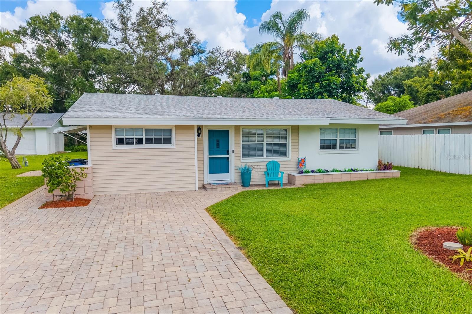One or more photo(s) has been virtually staged. NEW PRICE! This beautiful four-bedroom, fully remodeled home in the heart of South Sarasota, just minutes to Siesta Key and Turtle Beach. Featuring a lovely mature lot with an inground sprinkler system fed by a private well, on approximately 1/4 acre. With a seamless blend of comfort and style, meticulously designed with indoor elegance and outdoor entertainment. Let’s face it, it’s perfect for family gatherings and guests, showcasing the great raised deck with built-in seating! The property enjoys updated finishes throughout, including modern barn doors, tasteful accent walls, light bright open spaces with gleaming counters. Each room has been carefully crafted to balance contemporary design with practical functionality. Ability to convert part of the home into an air bnb which provides income! Outdoor enthusiasts will appreciate the great multiple entertainment areas surrounding this home. Enjoy morning coffee on the deck, host afternoon gatherings in the fully screened lanai, or relax under the awning-covered side patio with a glass of wine. Where ever you look, the beautiful mature landscaping creates a private sanctuary with extra wide stone driveway. There is plenty of room for a hot tub or pool.
The location is truly exceptional—situated conveniently off US41 across from The Landings with easy access to Phillippi Estates Park, the beaches and shopping.
Recent updates include gorgeous white sparkle quartz countertops, new stainless appliances, new HVAC, luxury vinyl plank flooring throughout, tankless water heater, new lighting, fans, etc. (roof replaced in 2020/2019). This home features a beautiful primary or guest suite, perfect for in-laws, complete with separate entrance, spa-like bathroom with bidet toilet, quartz counter, designer tile, barn doors and living room! On the opposite side of the home you will find 3 additional bedrooms and second bath room.