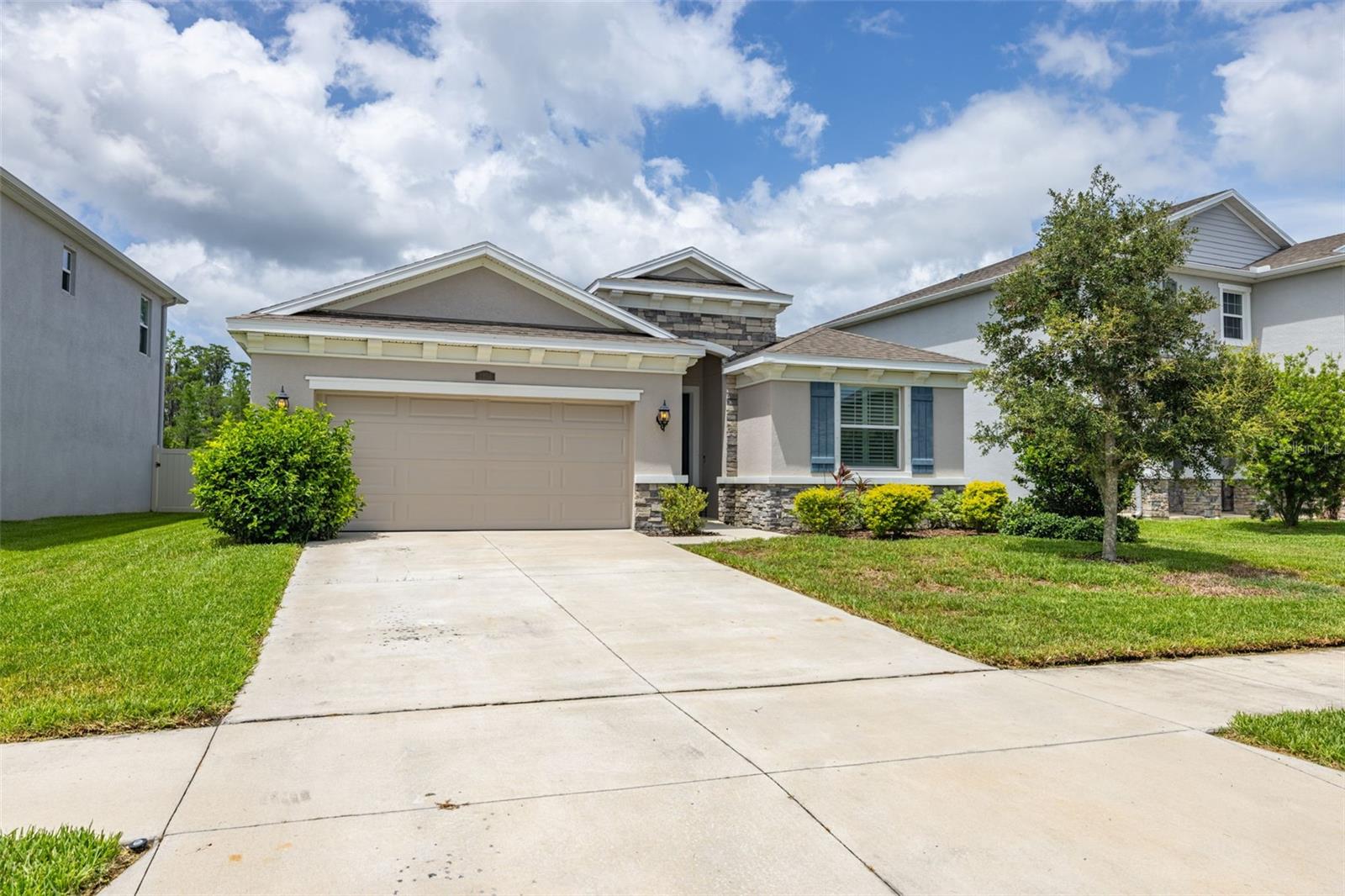 Welcome to this beautiful home in highly sought-after Odessa! The Preserve in Pasco County, Florida is where you will find this gently lived in 4 bedroom, 2 and a half bath, 2-car garage SMART home. Enjoy the ample space within this expertly designed split bedroom plan. The primary bedroom is separate from the 2 front bedrooms (with a full bath), and bedroom 4 (which could be used as an office) is convenient to the hallway half bath, laundry room, and great room. The primary bedroom boasts a decorative tray ceiling, upgraded canned lighting, double walk-in closets, and a luxurious ensuite with granite counters, double sinks, a garden tub for relaxing and a generous sized tile shower. Windows have highly desirable plantation shutters. The kitchen features stainless steel appliances, granite counters, a large island with available seating space, generous cabinetry, and a walk-in pantry. Upgraded and neutral 12”x 24” tile completes the main living area floors. The triple sliding door to the outdoor space has an indoor electric blind for the utmost privacy. The backyard is fully fenced with a privacy PVC fence and wrought iron look fencing near the private, deep conservation view. Birders may enjoy seeing and hearing ospreys, cardinals, hawks, and wrens. Your dog (or dog-to-be?) will enjoy fresh air and room to roam outside in your fully fenced backyard. Wait until you see the neighborhood resort style pool and the lap pool, fitness center, playground, dog park, soccer field and basketball court. It gets better! Publix supermarket is located at the front of this neighborhood, and in addition, area restaurants, Advent Hospital, the Suncoast Trail (biking, walking, running), and the Suncoast Expressway, which is a direct route to Tampa International Airport. Enjoy the Preserve life!