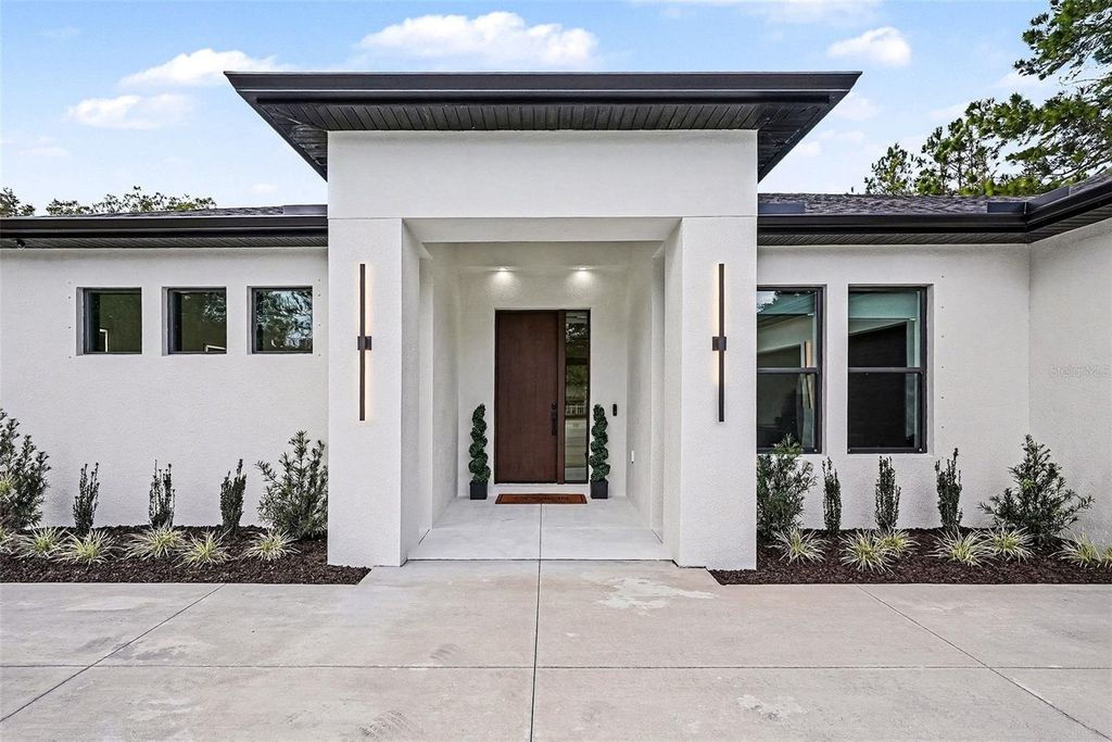 Photo of 17296 Raintree Road, Lutz, FL 33558 (MLS # TB8464962)