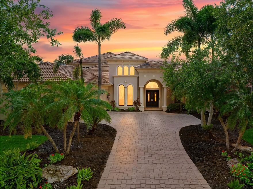 One or more photo(s) has been virtually staged. Welcome to the pinnacle of Florida luxury living on a premier cul de sac overlooking the prestigious Kings Dune’s 15th green in the heart of Lakewood Ranch. This exceptional estate, exquisitely crafted by John Cannon homes, combines elegant design, resort-style amenities and smart features to create a truly unforgettable home. Nestled on a premium half acre lot, the professional landscaping blends tropical palms and sophisticated oaks, setting the stage for the impressive elevation drawing your eye up the refined paver driveway to the substantial double front doors. Step inside to find a bright, open entryway enhanced by soaring 24’ ceilings and an expansive dining and gathering room framed by windows that flood the space with natural light. Feature your precious collectibles and artwork in the built-in entertainment center and multiple wall niches, creating easy displays to personalize your space and aesthetic. The aspiring chef will delight in the beautiful kitchen where crafting your culinary creations is a breeze with the help of high end appliances and a functional layout. The open concept affords effortless entertainment and promises that you never misses a moment or a memory whether your guests are seated at the counter, in the eat in kitchen area, the expansive living room with a warm gas fireplace or the bonus billiards room. Outdoor integration is seamless with collapsable glass doors to the expansive outdoor kitchen and screened oasis featuring a large, salt water pool and spa, comfortable ceiling fans, a television and a generous patio with ample seating and gathering areas. As days of adventures fade to peaceful evenings and sunsets, the first floor principal suite will be your personal retreat where a luxurious bath including a walk-in shower, soaking tub, double sinks and handsome travertine tile. This space is the perfect place to pamper and unwind while the custom owner’s closet will keep your fetching attire organized. This home offers three additional, generous bedrooms each with a private bath, a quiet office space, a second floor screened patio with pristine golf course views, multiple wet bars with wine storage, a water purification system, and 3 a/c units (each replaced since 2020). For those who love to tinker, the 3.5 car garage features epoxy flooring, it’s own a/c, new cabinets and shelves, upgraded electrical and an insulated attic space. Rest peacefully knowing your home is protected by waterproofed outdoor electrical, hurricane film on select windows and hurricane shutters, and a whole house gas generator. Located just minutes from world-class shopping, dining, top-rated schools and the vibrant culture and arts scene of Sarasota this home is ideal for a full time resident or an amazing seasonal escape. Experience the ultimate in Florida luxury living – where every detail is curated for comfort, style and relaxation. It’s more than a home, it’s a lifestyle!
