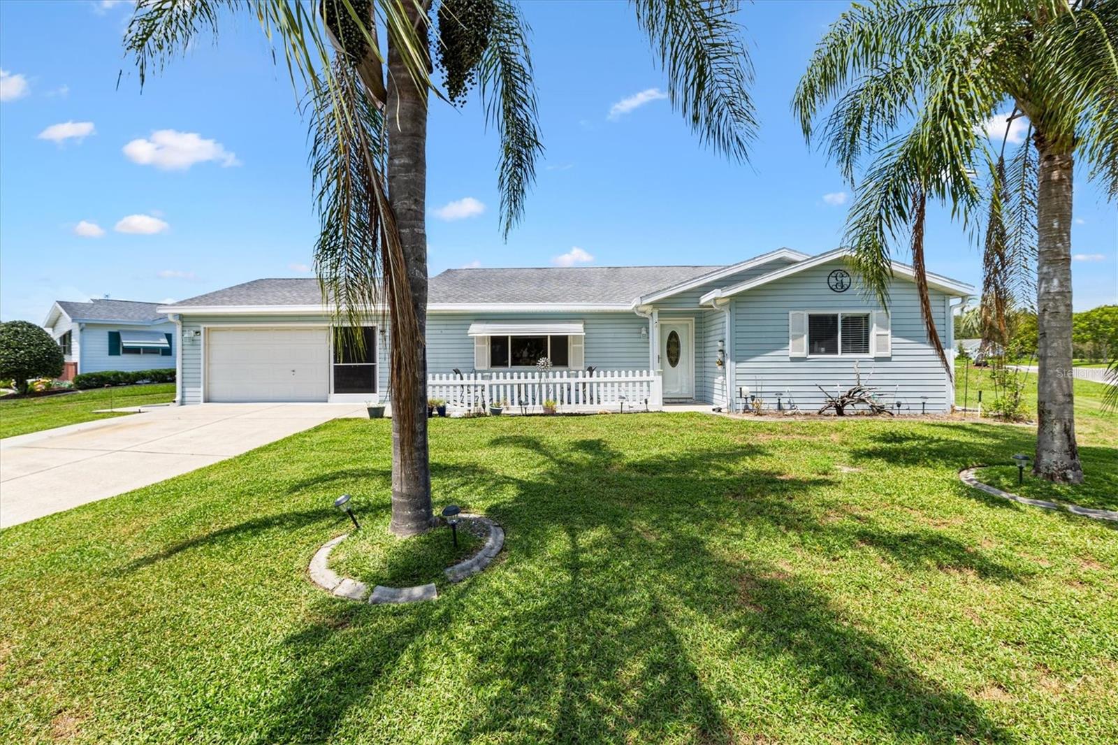 Located in Spruce Creek South, a vibrant 55+ Gated Golf Community with 24 hour guarded gate security, residents enjoy an abundance of clubs, activities, and amenities designed for an active lifestyle. The community’s prime location near The Villages provides convenient access to shopping, dining, and healthcare, making this home an ideal choice for those looking to enjoy comfort and convenience in a lively neighborhood. Oversized Palm Model offers 1,678 square feet of living space with 2 Bedrooms and 2 Baths. Recent updates include a HVAC (2013), NEW Washer and Dryer (2022), Water Heater (2022), ROOF (2011), Primary Bath remodeled with walk-in shower, NEW LUXURY VINYL PLANK Flooring, Water Filtration system, and Central Vacuum. The oversized, air-conditioned lanai provides the perfect space for relaxation or entertaining. Situated on a large corner lot, the property is angled to capture just the right amount of sunlight, creating a warm and welcoming atmosphere. This home is more than just a place to live, it’s a place to love!