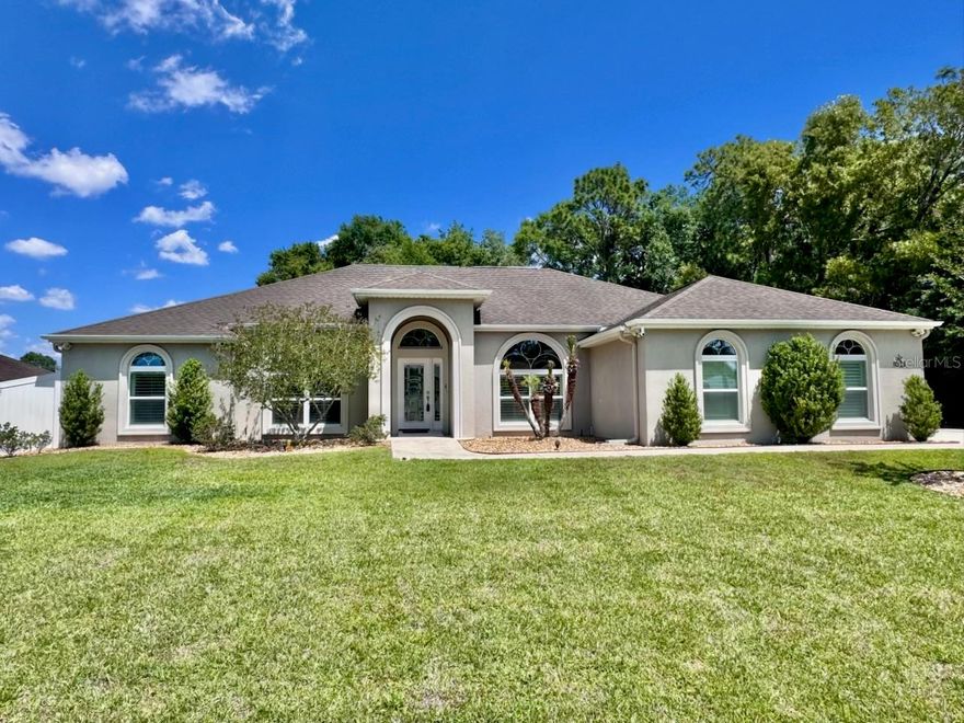 Welcome to a beautifully maintained 3-bedroom, with a dedicated office, 2-bath, plus OVERSIZED 2 CAR SIDE ENTRY GARAGE. This home, built in 2015, is designed for comfort, entertaining, and everyday serenity. Offering approximately 2,071 square feet of living space, this thoughtfully upgraded property blends peaceful design with high-end functionality — creating a private retreat ideal for both quiet living and unforgettable gatherings. Step through the LEADED GLASS FRONT DOOR into a light-filled interior featuring HIGH CEILINGS, TILE FLOORING ON THE DIAGONAL THROUGHTOUT THE MAIN LIVING AREAS, ARCHWAYS, a CENTER SCREENED ABOVE ATRIUM, and PLANTATION SHUTTERS throughout. The flexible FRONT OFFICE WITH DOUBLE DOORS provides a bright work-from-home or creative space, while the FORMAL DINING ROOM and OPEN LIVING AREAS create a natural flow for entertaining. The kitchen is both stylish and practical with GRANITE COUNTERTOPS, UNDER-CABINET LIGHTING, and a FULL PANTRY WITH CHROME PULL-OUTS.
The primary suite offers a relaxing retreat with DUAL SINKS, WALK-IN SHOWER, SOAKING TUB, and generous storage. Additional highlights include ADA-COMPLIANT FEATURES, INSIDE LAUNDRY WITH CABINETS AND SINK, NEST SMART SYSTEM, and GARAGE PULL-DOWN ATTIC ACCESS. Outdoor living is where this property truly shines. Enjoy a COMPLETELY FENCED BACKYARD, IRRIGATION SYSTEM, WOOD FIRE PIT, and a SPACIOUS SCREENED BIRDCAGE featuring a PATIO ROOM PRE-WIRED FOR 24-VOLT LED LIGHTING. The GLASS-ENCLOSED LANAI WITH MINI-SPLIT allows year-round comfort, while the COVERED OUTDOOR KITCHEN AND DINING AREA is designed for entertaining on a grand scale. The GOURMET OUTDOOR KITCHEN includes DUAL 5-FOOT STAINLESS STEEL HOOD VENTS, BUILT-IN SMOKER, 36-INCH GAS GRIDDLE, 36-INCH DUAL GAS GRILL, STAINLESS STEEL SINK, COMMERCIAL-GRADE OUTDOOR REFRIGERATOR, and a 10-FOOT BUTCHER BLOCK BAR crafted from REFURBISHED BOWLING ALLEY WOOD. A SEPARATE 100-AMP ELECTRICAL SUB-PANEL supports the outdoor space, along with PATIO VIDEO STREAMING PROJECTORS, SCREEN, and GOLF PRACTICE NETTING. Additional major upgrades include a WHOLE-HOUSE GENERATOR, 500-GALLON BURIED PROPANE TANK, WHOLE-HOUSE WATER FILTRATION, SOFTENER AND UV PURIFICATION SYSTEM, 35-AMP RV OUTLET, and PROFESSIONALLY INSTALLED HIGH-SPEED INTERNET AND VIDEO MONITORING. WI-FI-ENABLED SOLAR POWER MOTORIZED SUNSHADES enhance comfort in the covered outdoor living and dining areas, while the PATIO GAS FIREPLACE and 6-PERSON HOT TUB create the perfect atmosphere for relaxing evenings. Well-maintained, thoughtfully upgraded, and designed for both peaceful living and elevated entertaining, this home delivers a rare combination of comfort, technology, and lifestyle. Schedule your private tour today and experience this one-of-a-kind Zen retreat. ASK FOR A FEATURE SHEET FOR MORE DETAILS AND SCHEDULE YOUR APPOINTMENT TO VIEW TO ONE OF A KIND HOME. IT’S A MUST SEE!