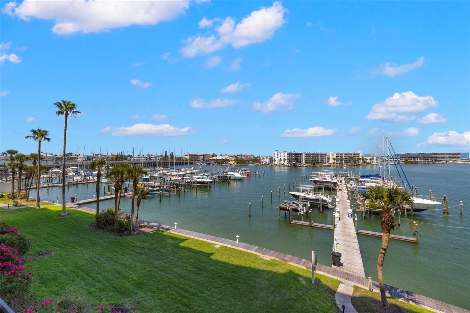 Live the coastal dream in this beautifully updated 3-bedroom, 2-bath condo in the gated luxury community Yacht and Tennis Club of St Pete Beach.. Just a short stroll to the pristine shores of Sunset Beach this spacious unit offers the perfect blend of beachside living and modern comfort. Step inside to an open and airy floor plan featuring abundant natural light, neutral finishes, and stylish upgrades throughout. The kitchen is equipped with granite countertops, stainless steel appliances, and a breakfast bar that flows seamlessly into the living and dining areas ideal for entertaining or relaxing after a day in the sun. The primary suite offers a peaceful retreat with a large walk-in closet and private en-suite bath. Two additional bedrooms provide flexible space for guests, a home office, or vacation rental potential. Enjoy water views from your private balcony. The community features resort-style amenities, including a heated waterfront pool, fitness center, 7 HarTru tennis courts, sauna, barbecue grills, a clubhouse and more. This move-in-ready condo offers the ultimate Florida lifestyle.