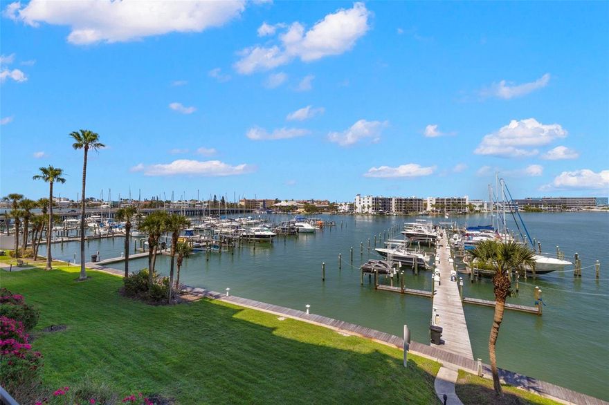 Live the coastal dream in this beautifully updated 3-bedroom, 2-bath condo in the gated luxury community Yacht and Tennis Club of St Pete Beach.. Just a short stroll to the pristine shores of Sunset Beach this spacious unit offers the perfect blend of beachside living and modern comfort. Step inside to an open and airy floor plan featuring abundant natural light, neutral finishes, and stylish upgrades throughout. The kitchen is equipped with granite countertops, stainless steel appliances, and a breakfast bar that flows seamlessly into the living and dining areas ideal for entertaining or relaxing after a day in the sun. The primary suite offers a peaceful retreat with a large walk-in closet and private en-suite bath. Two additional bedrooms provide flexible space for guests, a home office, or vacation rental potential. Enjoy water views from your private balcony.The property is undergoing a huge seawall project with assessment paid by the seller.  In addition an extensive landscape project will commence in October, also with assessment paid by the seller.  Updates have already been made to the courts and the gatehouse, and the seawall project also includes updates t the marina and a new kayak launch. The community features resort-style amenities, including a heated waterfront pool, fitness center, 7 HarTru tennis courts, sauna, barbecue grills, a clubhouse and more. This move-in-ready condo offers the ultimate Florida lifestyle.