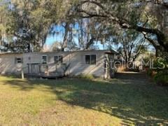 Beautiful lake front lot, with a ton of potential. granddaddy oaks on this property, with plenty of room for a variety of fruit trees, and a vegetable garden. The home and workshop will require a fair amount of work, to bring back to a livable condition. This is a great lot to build your dream home, or bring in a new mobile home. the well, septic, and power are all in place. *NOTE - The current dwelling on this property is UNSAFE and UNINHABITABLE, DO NOT ENTER, view at a distance. New homeowner can tear down or have it removed.