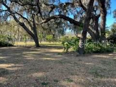 Beautiful lake front lot, with a ton of potential. granddaddy oaks on this property, with plenty of room for a variety of fruit trees, and a vegetable garden. The home and workshop will require a fair amount of work, to bring back to a livable condition. This is a great lot to build your dream home, or bring in a new mobile home. the well, septic, and power are all in place.