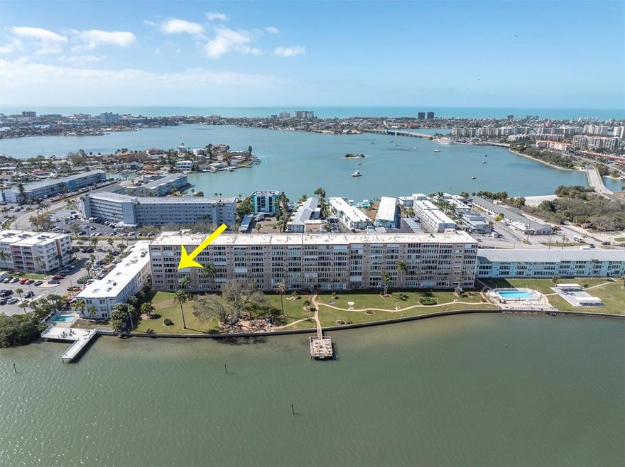 Welcome to Shore Crest in beautiful South Pasadena, where panoramic waterfront views of Boca Ciega Bay meet an active 55+ lifestyle.
From sunrise reflections on the water to evening breezes from your enclosed Florida room, this rare end-unit residence offers the perfect blend of serenity and community. Spanning 2,210 square feet, the largest floor plan in the building — this corner end unit with sweeping water views offers all new hurricane impact windows, enclosed Florida room overlooking Boca Ciega Bay, new A/C (2025), new washer (2025), dryer, gas furnace & stove. Unit owners enjoy a designated parking spot & ample guest parking. 
This steel-reinforced, fully owner-occupied community is well-managed by a proactive Board dedicated to financial stability and ongoing improvements. The BOD has completed and funded Milestone inspections (2023), plumbing stack replacement (8 floors), new roof (2025), new elevators, updated laundry facilities, new library, card and game room as well as exterior painting scheduled and fully funded (2026). 
 The all inclusive maintenance fee includes gas for heat/hot water/cooking, water, sewer, trash, building insurance including flood & liability, pest control, exterior and grounds maintenance, escrow reserves, two heated pools and many recreational facilities. Owners enjoy Spectrum high-speed internet & cable with FREE streaming services including Hulu, Disney+, HBO Max, Paramount+, Peacock Premium, Essential, AMC, Fox One, VIX and ESPN Unlimited. 
As if ALL that is not enough, the private community amenities include dock & kayak launch, two fishing piers with a cleaning station, two heated pools, gas grills with picnic areas, shuffleboard, corn hole, renovated clubhouse, fitness center, library and storage on each floor. Enjoy an active social calendar with many events such as bingo, cards, 1st Friday & more. 
 If you’re seeking waterfront living with financial stability, extensive upgrades in a welcoming 55+ community, this rare waterfront residence is not to be missed!