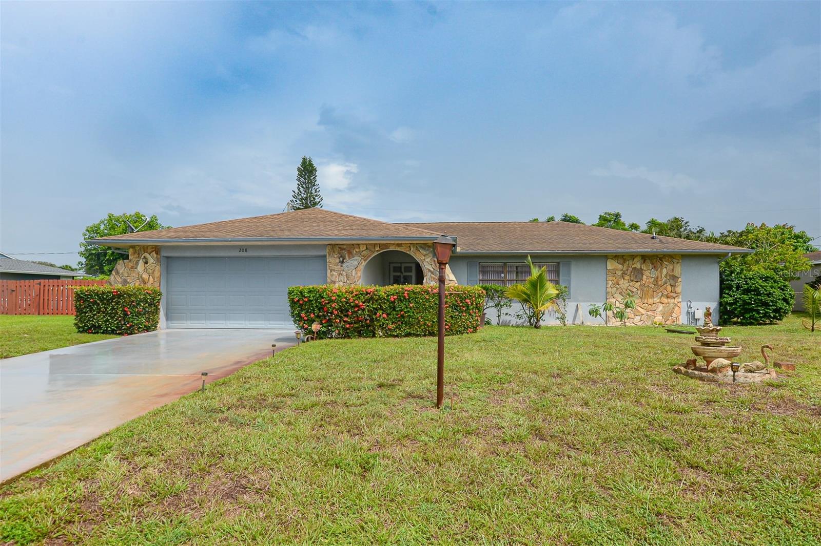Welcome home to this charming and spacious Port St. Lucie residence. Featuring a desirable split-floor plan with 3 bedrooms and 2 baths, this house offers both privacy and a fantastic flow for everyday living. The sun-filled, eat-in kitchen is the heart of the home, complemented by a separate formal dining and living area. Outside, the large front and backyards offer ample green space for play and gardening. Spend relaxing evenings in the comfort of your screened-in lanai. Major systems are updated, with a 2020 roof and 2018 HVAC, so you can move in with confidence.