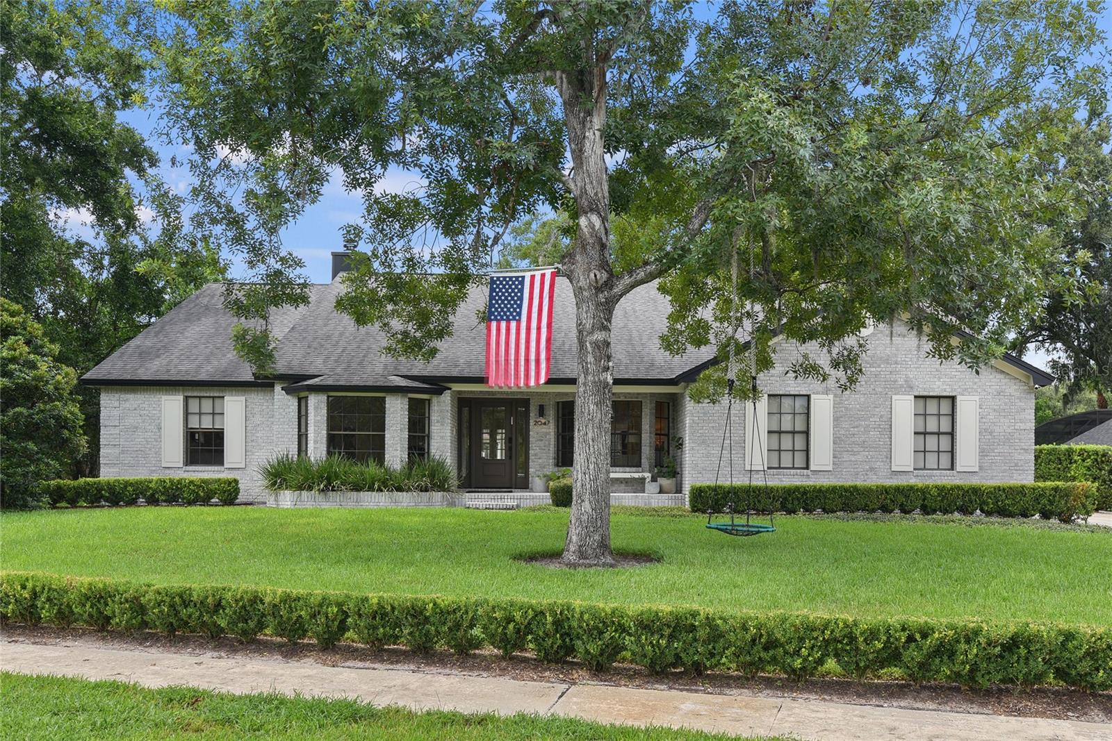 The home you’ve been searching for has officially hit the market! Welcome to 2047 Howell Branch Road, the four bedroom, two bath home offering 2960 square feet of pure comfort. The beautiful exterior with its striking curb appeal will immediately draw you in before you even set foot inside. Entering through the foyer, you will feel a welcoming ambiance being flanked by a home office on one side and a multi purpose room on the other, flowing right into the wide open living spaces straight ahead. The family room features a brick fireplace, high cathedral ceilings and so much natural light seamlessly connecting to the kitchen, which has been updated to perfection. The large island has a beautiful stainless farmhouse sink and the cooktop encompassed inside the whitewashed brick nook will tempt even the most novice chef into whipping up an extravagant meal. The abundant natural light reflects off the stunning countertops and decorative mirrored backsplash adorning additional countertop space and even more cabinet storage for all of your culinary supplies. The dining area sits right next to the kitchen, centered around a beautiful bay window and wooden beamed ceiling with an artistically designed chandelier. The split floor plan is tastefully done with the master off to one side featuring a large ensuite bathroom with dual closets, a seating area, a large tub and walk in shower. To the other side of the living space is a hallway with the additional three bedrooms, a bathroom, the indoor laundry room with garage access and a flight of stairs leading up to the loft overlooking the downstairs that can be used in a number of creative ways. Exiting through either the main living area or the dining room, you will walk out onto a beautifully redone patio featuring marble tile under cover with a large ceiling fan. The backyard of this home is something out of your imagination, fully encompassed by a newer wood fence and featuring a fire pit and a hand constructed tree house with ninja warrior vibes, not to mention the newly installed heated pool featuring a sizeable sun shelf and color-changing lights to keep the fun going well into the evening hours. The sheer size of the backyard alone will have you continuously coming up with ways to take the fun outdoors. With neighborhood lake access, zoning for top rated schools and close proximity to everything the cities of Maitland and Winter Park have to offer, this is the one you won’t want to miss. Schedule your life-changing showing today!