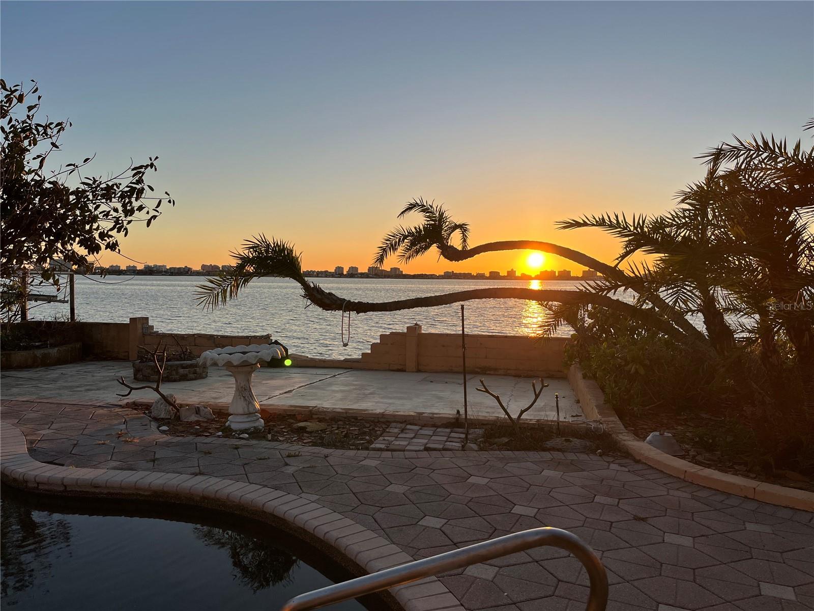 Dream Waterfront Opportunity on the Intracoastal — 130’ of Open Water Views
Welcome to 1844 Venetian Point Drive, a rare waterfront gem nestled on a quiet cul-de-sac in one of Clearwater’s most coveted neighborhoods. This expansive 1.5-lot over one third acre property offers unmatched 130 feet of wide-open Intracoastal frontage, delivering breathtaking west-facing sunsets and panoramic views of Island Estates, Clearwater Beach, and Caladesi Island State Park.
Endless Outdoor Living
Relax poolside, sip cocktails at the two-sided bar in your private cabana or dine al fresco under the gazebo as you watch dolphins and manatees glide by. With multiple outdoor seating areas and lush landscaping, there’s always a perfect spot to soak in the Florida lifestyle — no matter the time of day.
Deep Water Access & Boater’s Paradise
Boating enthusiasts will love the deep-water dock with quick access to the Gulf of Mexico (aka Gulf of America). Cruise the Intracoastal, fish off your dock, or paddle to nearby beaches and islands — it's all just steps away.
Unbeatable Location
Perfectly positioned between Downtown Dunedin and Downtown Clearwater, you’re just minutes from the Pinellas Trail, Honeymoon and Caladesi Islands, Clearwater Beach, golf courses, local restaurants, art festivals, and live music at the new Clearwater Sound Amphitheater.
Ready for Your Vision
The existing 3-bed, 2.5-bath pool home (approx. 2,100 sq ft) experienced water damage during Hurricane Helene and is being sold as-is, creating an exceptional opportunity to rebuild, elevate, or design your custom dream home on one of the largest waterfront lots on Venetian Point Drive.
Don’t miss your chance to own this one-of-a-kind waterfront property in a location that truly has it all — space, views, privacy, and potential.
Measurements are approximate and should be verified.