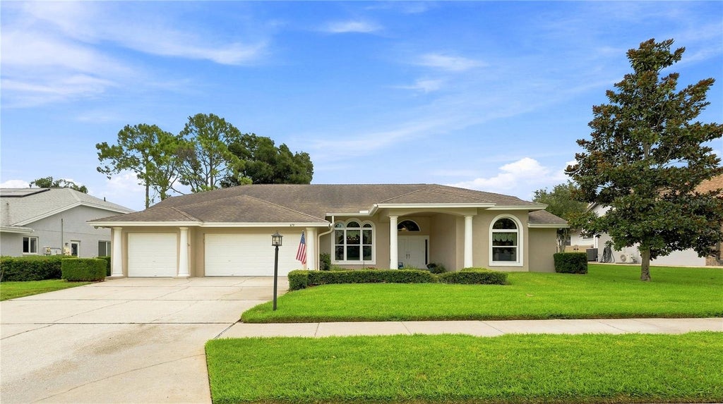 Photo of 679 Litchfield Lane, Dunedin, FL 34698 (MLS # A4704853)