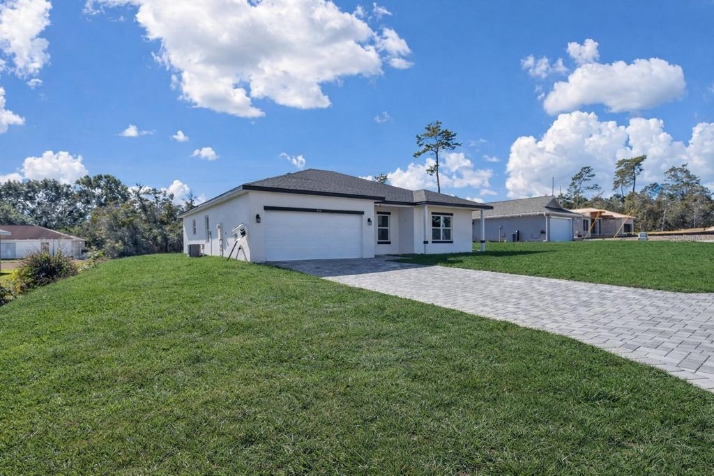 Photo of 2148 SW 155th Lane, Ocala, FL 34473 (MLS # O6369993)