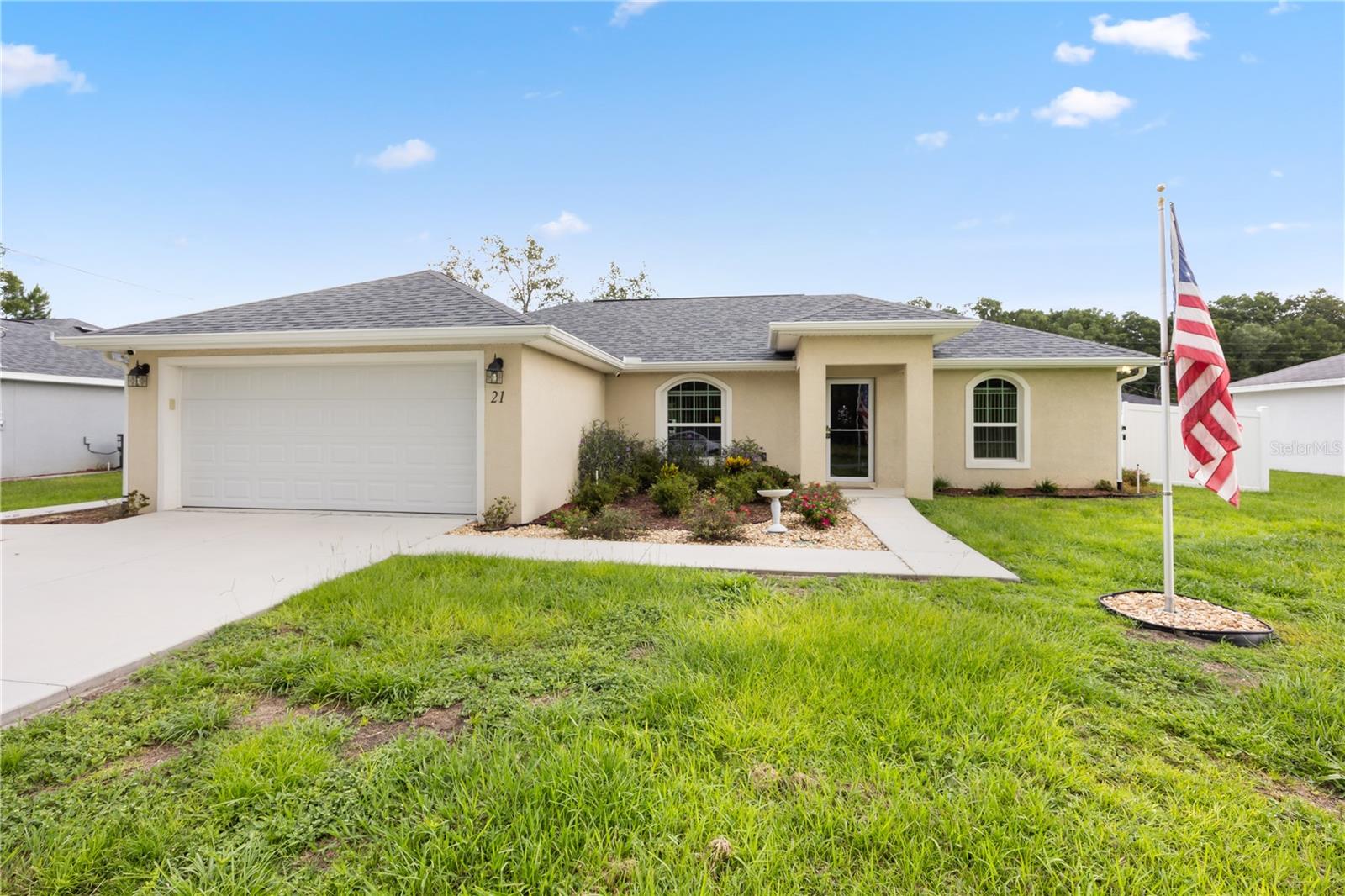 Welcome to 21 Walnut coarse, Ocala, Fl 34480. This immaculate move-in ready home build in 2020 is packed with modern features that will exceed your expectations. As you step inside you find high ceilings, a split-floor plan creating an effortless flow throughout the home. The gourmet is a culinary delight, featuring elegant cabinets, granite countertops and steinless steel appliances. Master suite, complete with a private bathroom and a walk in closet. The bedrooms are spacious and comfortable, providing the perfect retreat to rest and recharge. Step outside from the dinning room to a covered screened lanai, an ideal spot to enjoy your morning coffee, read a book or sip on a cocktail in the evenings. The generously sized backyard is perfect for entertaining, gardening or relaxing. The Brick pavers- a vibrant and inviting area for seating and grilling. Recent updates include WHITE VINYL FENCE, GUTTERS, WATER SOFTER, IRRIGATION SYSTEM, SHED, STORM FRONT DOOR, WINDOW TREATMENT, AND PRE-WIRED SECURITY SYSTEM. The home also includes a two-car garage for added convenience. Located minutes away from shopping centers, dining, medical facilities, and public parks. Call today to schedule a private showing!