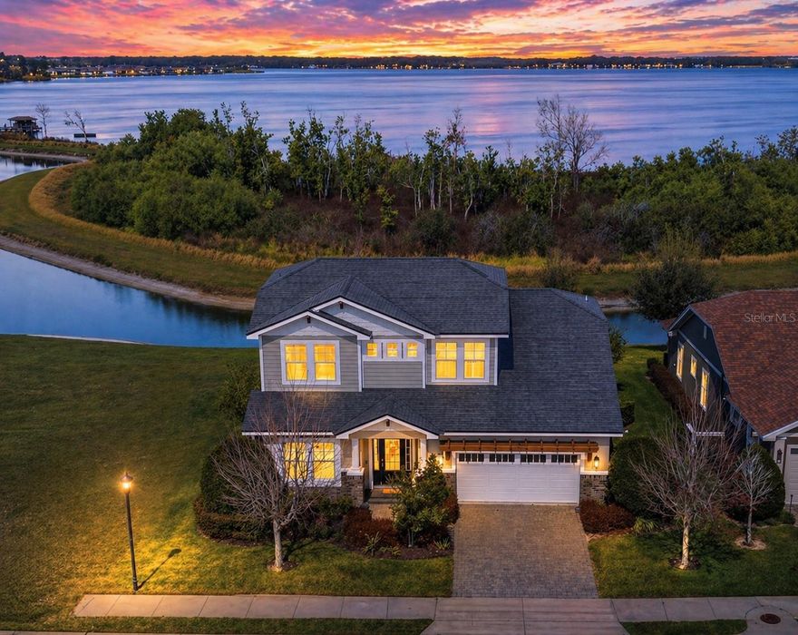 PRICED BELOW RECENT APPRAISAL!! Experience refined Florida living in this custom-built 2018 Hulbert Homes pool home ideally positioned on a tranquil pond with beautiful upper-level views of Lake Van, located within the gated and highly sought-after community of Water Ridge. Offering 2,911 square feet of living area, this thoughtfully designed residence features 3 bedrooms, a private office, a spacious loft that could easily serve as a 4th bedroom, and 2.5 bathrooms, blending comfort, flexibility, and style.

Designed for both everyday living and entertaining, the open-concept first floor showcases a welcoming great room, spacious dining area, and a well-appointed kitchen. The kitchen features a large island with a breakfast bar, walk-in pantry, stainless steel appliances, and the rare convenience of two dishwashers. Gorgeous wood flooring flows throughout the living spaces, complemented by elegant crown molding that adds a refined touch throughout the main living areas.

The primary suite is privately located on the first floor and enjoys peaceful pool views, along with a generous walk-in closet with linen storage and a spa-like en-suite bath featuring granite countertops, dual sinks, a freestanding soaking tub, and a large walk-in shower. Also on the main level are a private office with French doors, a convenient guest half bath, mudroom off the garage, inside laundry room with extensive cabinetry and granite folding counter, and access to the 2-car garage with epoxy flooring.

Upstairs, the expansive loft offers flexibility as a second living area, playroom, or potential fourth bedroom, while picture windows capture stunning views of Lake Van. Two additional generously sized bedrooms share a well-appointed bathroom with granite countertops, dual sinks, and a tub/shower combination. The home also provides excellent storage, including multiple closets, an under-stair storage space, a walk-in storage closet, and additional linen storage upstairs.

Outdoor living is equally impressive with a screen-enclosed saltwater swimming pool built in 2021, surrounded by pavers and complemented by a covered lanai perfect for year-round enjoyment. Whether hosting friends under the covered patio with the wall-mounted TV or relaxing poolside in the Florida sunshine, this backyard retreat was designed for both entertaining and relaxation.

Additional features include ceiling fans and window blinds throughout, an irrigation system with timer, mature landscaping, and more.
Residents of Water Ridge enjoy an exceptional lifestyle with resort-style amenities, including a clubhouse, state-of-the-art fitness center, sauna, three community pools (including a lap pool), tennis, basketball and pickleball courts, three boat docks, community boat ramps, and boat/trailer storage.

Ideally located between Tampa and Orlando, this beautiful home offers the perfect blend of luxury and convenience in one of Central Florida’s most desirable gated communities. Schedule your private showing today and experience Water Ridge living at its finest.