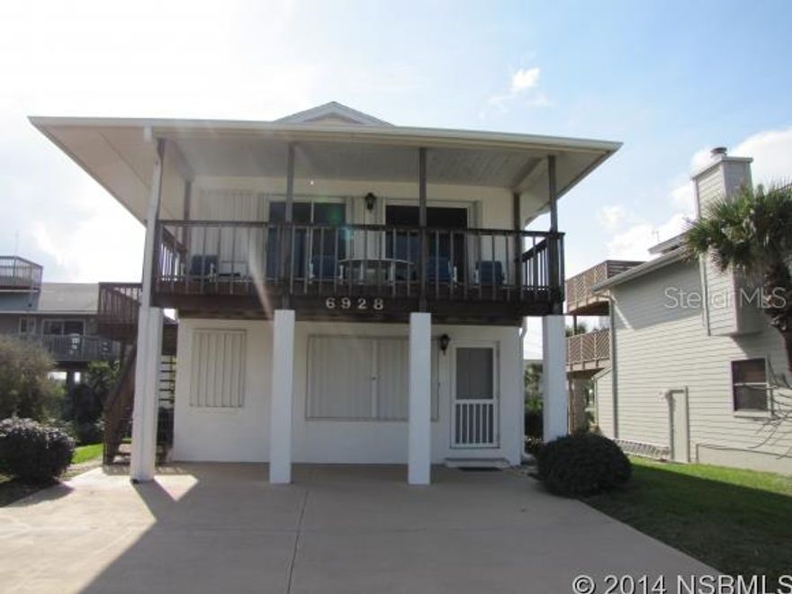 A unique beachside home on the west side of S Atlantic  includes 25' lot on the ocean. The house extends from S. Atlantic to Turtlemound Rd. Huge garage with room for a motor home. Lots of decking. Two bedrooms down with family room and bath. One bedroom upstairs with bath, kitchen, dining and living room. View of the ocean from the east balcony and rooftop deck. Rock revetment on oceanfront lot included and no driving on the beach area. Close to Canaveral Seashore. Walk to the river. ;Water: City