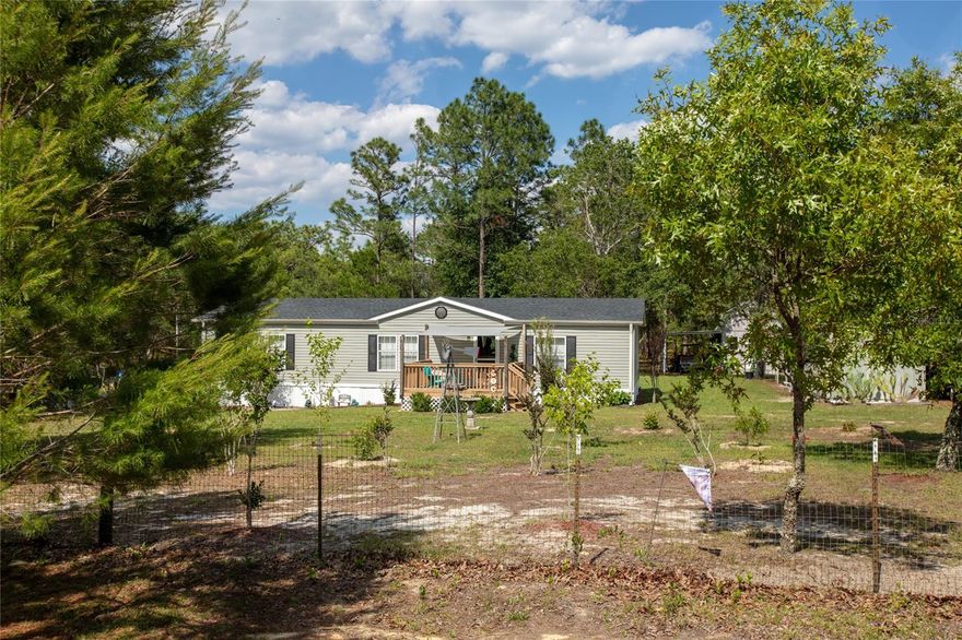 Welcome to 5670 Acadia in Keystone Heights, FL! This 3-bedroom, 2-bath home offers the perfect blend of comfort, updates, and outdoor space on 4 fully fenced acres. Inside, the primary bathroom features both a shower and garden tub, while the home also includes updated flooring and appliances from 2019. Major improvements include a new roof in 2025 and new skirting in May 2026. Outside, this property is packed with features--an above-ground pool, 3 patios, 2 drive-through gates, and parking for 5 vehicles. There's also a charming insulated she shed with drywall interior, ideal for hobbies, storage, or a creative workspace. The land is filled with fruit trees and flowering vines, including peach, guava, Meyer lemon, kumquat, navel orange, passion fruit, and hummingbird vine. This property offers space, privacy, and plenty of room to enjoy Florida living. Added bonus is porches on both front and back. Easy commute to Jacksonville, Gainesville and Palatka.