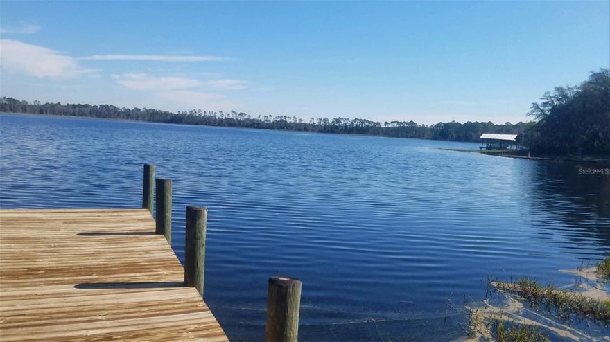 There are two lots available. Lot #1 is ready for a custom home available for $210,000. Lot #2 has a large 3 bay boathouse with two electrical boat lifts, one with remote control, a bait holding tank and a storage building on the dock is available for $279,500.  Both Lots have 150 feer of lake front on Lake Susan. Lake Susan is a private lake that is sand bottom and spring fed with no public access. Lake Susan provides great bass fishing, water skiing and boating. The Lake is surrounded by approximately 4,000-6,000 acrea. These acres have been protected by placing the land into the Florida Forever Program. Within this protection program is guarantees protecting from development for approximately 100 years. Approximately 20 personal houses surround the lake. Many have been in families for generations.