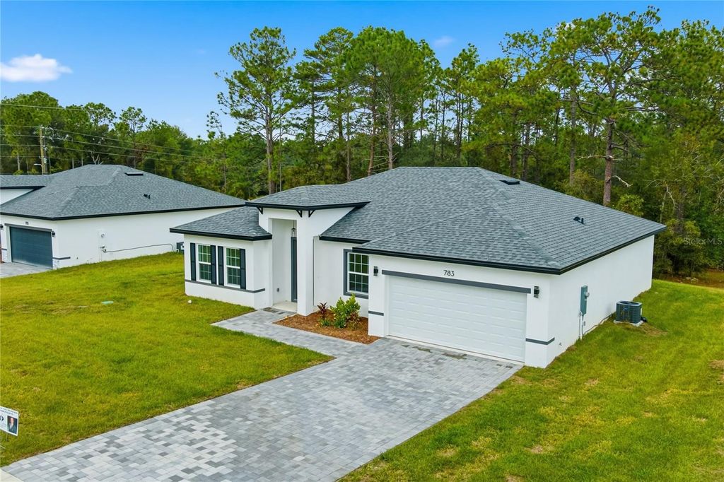 Photo of 783 Marion Oaks Trl, Ocala, FL 34473 (MLS # O6361842)