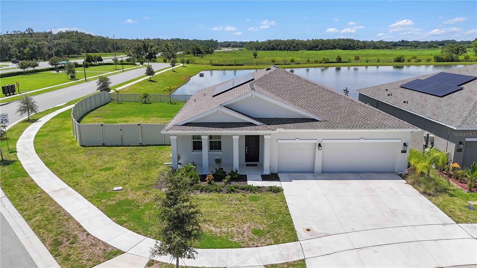 One or more photo(s) has been virtually staged. LIKE NEW - Built in 2023! This SMART Energy efficient home sits on an oversized, premium private corner lot with water and conservation views, tucked away at the back of the neighborhood.
The Lincoln floor plan features four roomy bedrooms, two bathrooms, and a three-car garage. Fresh, modern floorplan with soaring vaulted ceilings in the great room. Large island with seating, ample cabinet and countertop space, SS appliances, stone countertops and pantry. Sliders lead out to a patio and oversized fenced yard with water views.
The owner's suite is a true retreat, featuring an oversized bedroom connected to a spa-inspired bathroom with dual vanities, a walk-in shower, and a large walk-in closet. A flexible room off the entryway is perfect for a home office, formal dining or living space.
This home includes many desirable features like green building technology and energy-conscious appliances. Plus, a solar power system helps offset utility bills.
Nestled in nature yet convenient, the Old Hickory community provides something for everyone. Amenities include a resort-style swimming pool with a cabana, a playground, and a dog park. With easy access to the Florida Turnpike and abundant shopping and dining options nearby, you can also enjoy outstanding fishing areas, wildlife reserves, and hiking trails. Check out the video tour online and schedule a private tour today!