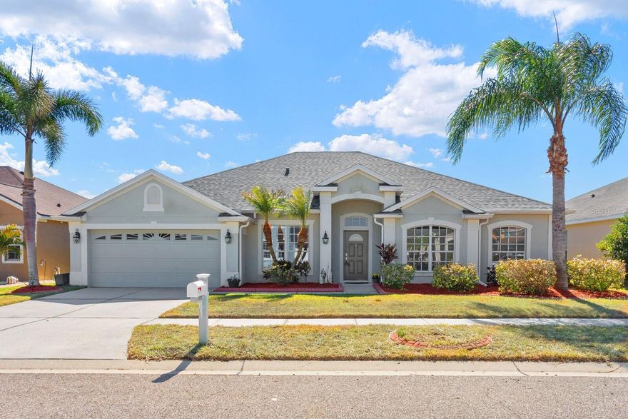 One or more photo(s) has been virtually staged. Beautiful ONE-STORY home on a premium homesite with peaceful pond and conservation views in highly sought-after Panther Trace, a walkable community featuring a pool, playground, clubhouse, and great neighborhood amenities. This spacious 4 bedroom, 3 bathroom home offers a desirable three-way split floor plan, providing exceptional flexibility for guests, home offices, or multi-generational living. Major updates include a ROOF (2025) , AC (2021) and WATER HEATER (2021) for added peace of mind. The upgraded kitchen features 42" maple cabinetry with granite countertops, tile backsplash, undermount stainless sink, built-in microwave, gas range, spacious pantry, and breakfast bar overlooking the family room with a custom built-in bookcase and a cozy wood-burning FIREPLACE. The primary suite offers a relaxing retreat with a large walk-in closet, dual vanities with granite countertops, private water closet, garden tub, and separate walk-in shower. Additional highlights include plantation shutters on the lanai door and an oversized covered screened-in patio (added within the past 10 years). Enjoy the serene pond and conservation views from the large backyard which offers plenty of room to play or add your own pool. Homes with this floor plan, one-story layout, and conservation views rarely come available in this neighborhood. Schedule your private showing today and come see why this home stands out.