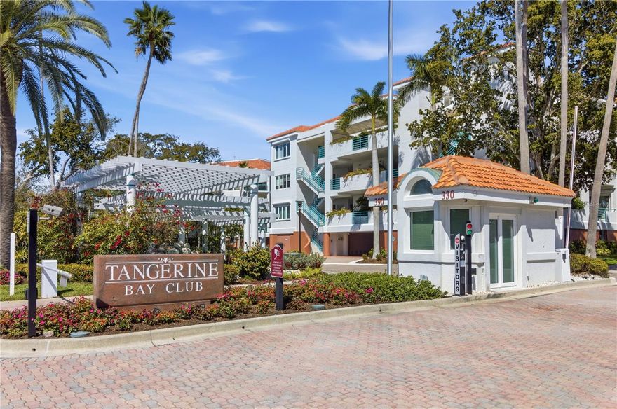 Welcome home to this impeccably remodeled corner residence in the highly sought-after south Longboat Key community of Tangerine Bay. From the moment you arrive, the lushly landscaped entrance sets the tone — offering privacy, tranquility, and the promise of refined coastal living.  Inside, expansive views of Sarasota Bay take center stage, framed by hurricane-impact windows and additional side windows exclusive to select end units — because when you secure a corner residence, you deserve the extra light (and the extra bragging rights). Natural light pours in, enhancing the open, airy feel throughout.  The generously sized kitchen is designed for those who take their cooking seriously — or at least want to look like they do. Quartz countertops provide abundant prep space, complemented by JennAir stainless steel appliances and a convenient gas grill connection on the front patio for seamless indoor-outdoor entertaining. Whether it’s a casual brunch or sunset cocktails, this space performs beautifully.  Overlooking the main living area, the kitchen flows effortlessly into a sophisticated gathering space featuring a gas fireplace, dry bar, backlit tray ceiling, and direct terrace access. It’s equal parts cozy and impressive — perfect for quiet evenings or lively hosting.  The primary suite is a true retreat, welcoming you through grand double doors into a spacious sanctuary complete with a walk-in closet, dual vanities, custom built-ins, frameless glass shower, and private terrace access. Morning coffee here simply tastes better.
Guests are treated with equal consideration thanks to the thoughtful split floor plan. The ensuite guest bedroom with wood floors provides comfort and privacy away from the primary suite. A dedicated office with custom built-ins and wood flooring offers flexibility and can easily convert to a third bedroom — because life evolves, and your home should too.  Adding to the appeal, a private two-car garage with additional storage is located underneath the building, delivering the convenience and feel of a single-family home — without the maintenance responsibilities.  Tangerine Bay offers a true resort-style lifestyle, featuring a 25-meter freeform pool with dedicated lap lanes, spa, lagoon, waterfalls, fitness center, tennis and pickleball courts, day dock, and fishing pier. Whether you prefer morning laps or sunset casts, the options are plentiful.  Residents also enjoy membership eligibility at the private Bay Isles Beach Club, offering tropical cabanas, pavilion, grills, picnic areas, volleyball courts, private showers, and pristine Gulf-front access. In other words — the beach life, handled properly.
This is more than a residence. It’s a refined coastal experience designed for those who appreciate quality, comfort, and just the right amount of understated luxury.