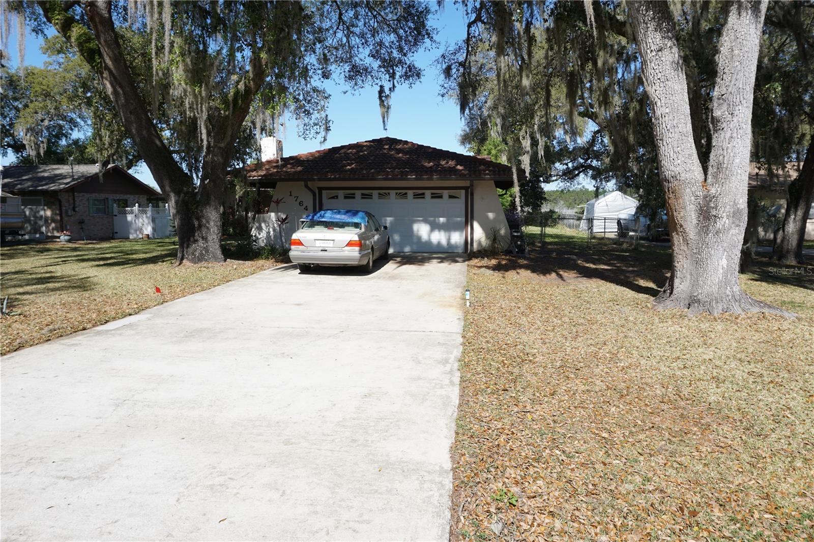 Beautiful North Lake Bryant, from this home it is just a short canal ride to the main lake. You'll enjoy the In-ground Screen Enclosed Pool and being right on the freshwater canal that you can bass fish from your backyard or boat out to the 185-acre lake for water skiing, boating and fishing. There are nice open views from your pool as you look out on State owned water and marsh area so no one can live behind you with sand cranes & herons that can be seen from your yard. This 2-Bedroom, 2-Bathroom, 2 Car Garage home has a wood burning fireplace and more great views though the glass doors leading to the 14' x 40' screen room connected to the 23' x 42' screen enclosed pool deck with its In-ground pool. This community has it's own private beach area, boat ramp and clubhouse. This area has lots of lakes, springs, rivers, parks, walking trails and trail riding. Ocala with all it has to offer is just 15 minutes away. Come enjoy the beautiful outdoors.