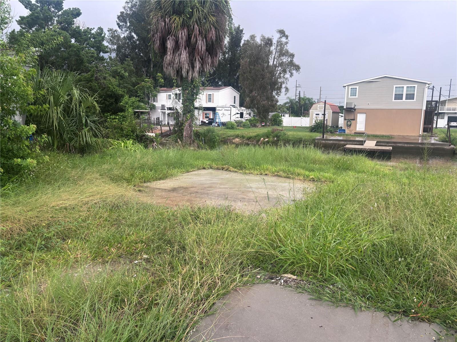 DISCOVER THE PERFECT PLACE TO BUILD YOUR DREAM HOME, ON THIS CANAL-FRONT LOT WITH DIRECT ACCESS TO THE GULF OF MEXICO! IDEAL FOR BOATING, FISHING, THIS PROPERTY OFFERS THE ULTIMATE FLORIDA LIFESTYLE. THE ZONE FOR R1MF IS LOCATED IN A RESIDENTIAL NEIGHBORHOOD WITH NO HOA OR CDD. THIS VACANT LAND IS READY TO BUILD WITH IN-PACT FEE'S ALREADY PAID. THE EXISTING MOBILE HOME WAS DEMOLISHED, AND THE SITE IS CURRENTLY CLEAR, WITH A CEMENT DRIVEWAY AND A CEMENT BLOCK DOCK. BRING YOUR BOAT. IT IS CONVENIENTLY SITUATED NEAR WATERFRONT RESTAURANTS AND A HOSPITAL. DON'T MISS THIS OPPORTUNITY TO OWN A PIECE OF PARADISE.