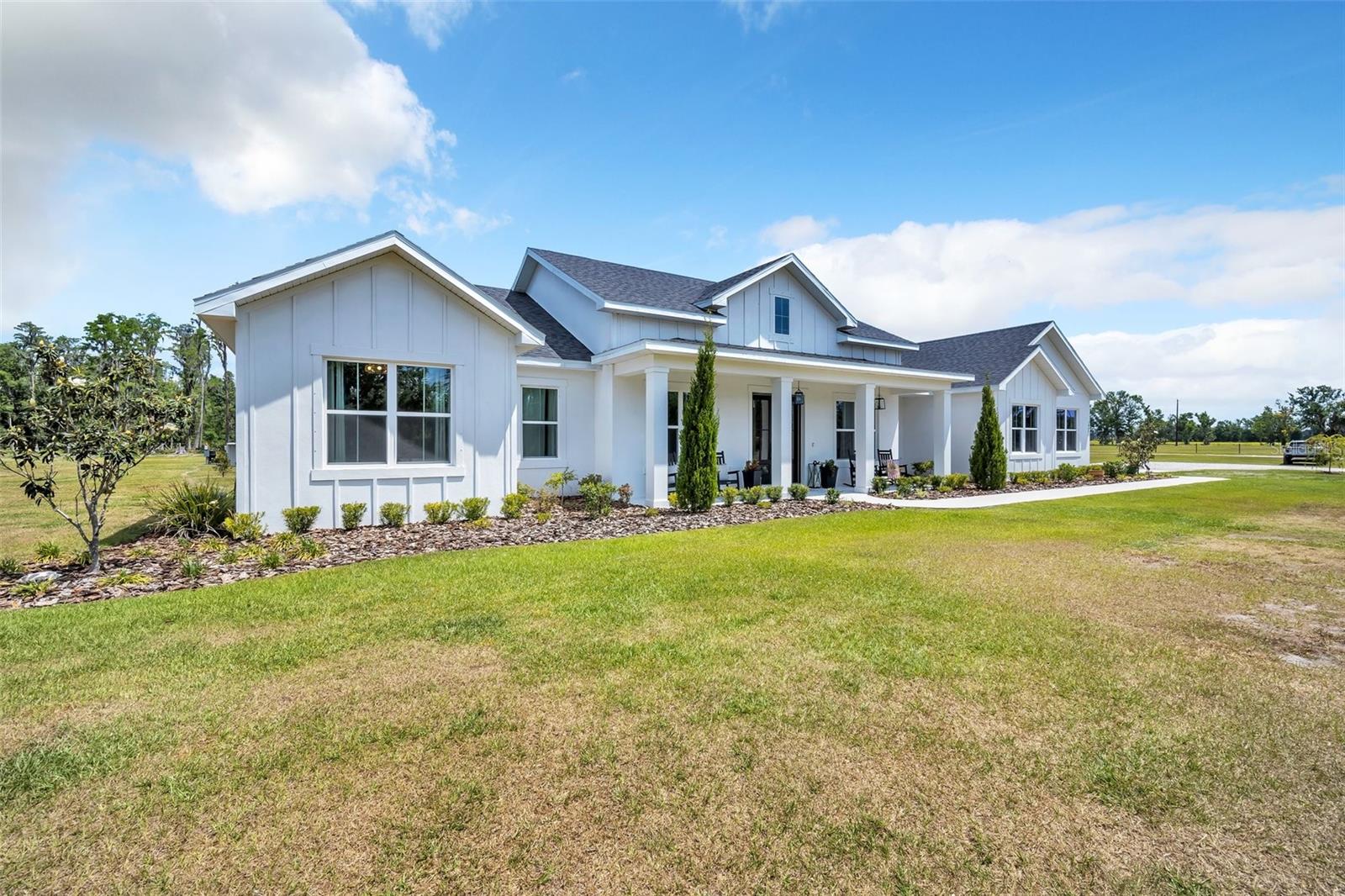 Experience the perfect blend of lifestyle and luxury in this exceptional 2023-built modern farmhouse built by Kevco Builders, nestled on just over 5 peaceful acres. Designed for those who appreciate space, comfort, and a refined rural lifestyle, this property offers elegance, versatility, and charm at every turn.
The main home features a split floor plan with upscale finishes, custom built-ins, and an open-concept layout filled with natural light. A chef’s kitchen anchors the heart of the home, flowing seamlessly into the spacious living and dining areas—ideal for both entertaining and everyday living.
Step outside to your own private retreat complete with a sparkling pool, a fun custom-built treehouse, and a beautiful cypress grove that provides a picturesque backdrop and natural privacy.
In addition to its stunning outdoor spaces, the property also includes a chicken coop and small storage barn, offering functionality and the opportunity for homesteading or hobby farming.
A standout feature is the attached guest house—complete with two bedrooms, one and a half baths, a full kitchen, private entrance, and screened-in back porch. It's the perfect setup for multigenerational living, extended guests, or potential rental income.
This one-of-a-kind property delivers the best of lifestyle, luxury, and rural living—a modern farmhouse retreat where every detail has been thoughtfully crafted.