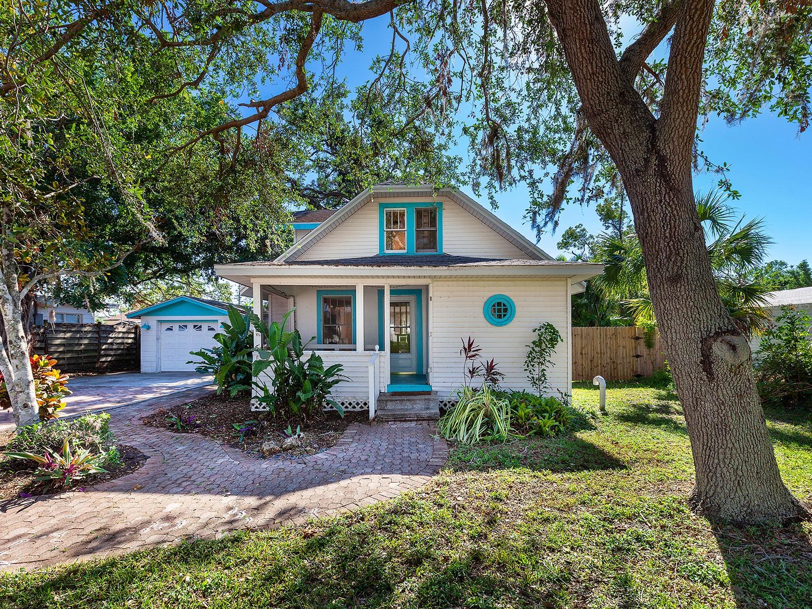 One or more photo(s) has been virtually staged. Buyer Incentive! 2/1 buy down with rates starting as low as 4.99%.Welcome to this enchanting historic cottage, thoughtfully on a generous .42-acre lot in the heart of town with a Brand New Roof (2025) and foundation work completed (2025). Full of character and warmth, this delightful home seamlessly blends timeless vintage charm with modern updates. Recent enhancements include new flooring throughout and a beautifully renovated kitchen, providing the ideal combination of old-world appeal and contemporary convenience. In an A-rated school district, this home is ideally just a short distance from Riverview High School, making it an exceptional choice for families looking for proximity to top-tier education. The property features a detached garage that is equipped with water and electricity with incredible potential for transformation, whether you envision it as a cozy studio apartment for guests, a private home office or a potential source of rental income. With no deed restrictions, the possibilities are endless, allowing you the freedom to personalize this property to suit your needs and desires. Beyond the property itself, the location offers unparalleled convenience. Just a few miles from the world-renowned Siesta Key and its stunning white-sand beaches, you’ll have the best of both worlds, a peaceful, spacious home offering privacy and tranquility, with easy access to the vibrant attractions and natural beauty of Florida’s Gulf Coast. This is a rare opportunity to own a piece of history in a prime location, offering charm, character and endless potential. Whether you’re seeking a family home, a vacation retreat or an investment opportunity, this one-of-a-kind property has it all.