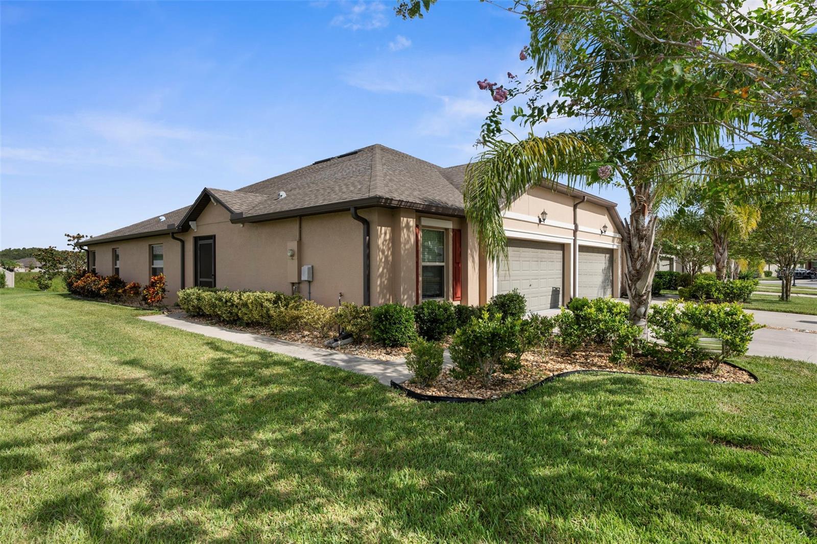 Looking for the perfect low maintenance house for your Florida easy living, then this is the
home for you. This villa will check all the boxes from the outside to the inside.
As you pull up to the property you realize that there are no neighbors on one side as the lot
adjoins the large corner open area.
As you enter through the front door you instantly see a spacious open plan living room and
kitchen with sliding glass doors that lead out to the patio with a beautiful Florida feel. No
backyard neighbors as you back up to a pond so privacy here is top notch. The kitchen has a
nice size pantry, and elegant looking cabinets and counter tops. Tile floors flow through the
main living for ease of keeping clean and cool. The master bedroom is large and bright and airy
with a walk-in closet that already has the built ins you need to keep yourself organized. There
is even a lighted mirror for putting on the finishing makeup or jewelry touches. The master has
an ensuite bathroom with a stand-up shower and glass doors and double vanity.
Your family members or guests will enjoy the additional two bedrooms each with a good size
closet and access to the second full bathroom that features a tub shower and single vanity. All
the bedrooms have ceiling fans and windows come with already installed blinds.
Moving to the garage you realize that storage will be no problem in this home with a good size
two car garage with garage door opener leading out to a generous driveway with room for 2
cars. Laundry is inside the home for your convenience and comfort.
To enhance your Florida living, you can enjoy this home without having to worry about exterior
maintenance as the irrigation, lawn care, roof replacement and exterior maintenance is
included in your monthly fees. While this is all being taken care of for you, you can relax and
enjoy the gorgeous onsite amenities like to huge pool with kid play area and lap lane or fish of
the fishing pier at the lakeside. More into sports, then you can play tennis or pickle ball or
enjoy the half-court basketball court or simply enjoy some time at the playground with your family. There is much to enjoy in this community and with this home. Come and see this
house today to make this villa your home.