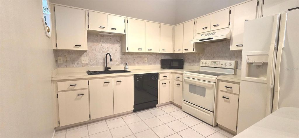 Photo of 2101 Fox Chase Boulevard #203, Palm Harbor, FL 34683 (MLS # TB8487561)