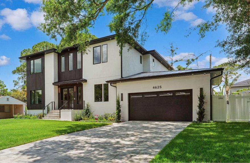 SELLER OFFERING 2/1 BUYDOWN AT LIST PRICE! LOWER YOUR INTEREST REATE BY 2% YEAR 1 AND 1% YEAR 2 WITH THIS SPECIAL OFFER! Step into sophistication with this newly built stunning executive pool home, perfectly positioned within the highly coveted A+ school district, including Mabry, Coleman, and Plant. This contemporary masterpiece spans 4,544 square feet, offering 5 bedrooms, 4 full bathrooms, a formal dining room, and a thoughtfully designed mudroom, all set on an expansive 78x110 lot. The versatile fifth bedroom, located on the first floor, serves effortlessly as a guest suite or private home office. A small bonus room on the same level provides a tranquil retreat – ideal for a yoga studio, playroom, or pet lounge. Crafted with impeccable attention to detail, this newly constructed home boasts block construction, Low-E impact windows and doors, and elegant paver finishes across the driveway, patio, and porch. The open floor plan is designed for both comfort and grandeur, anchored by a spacious living area featuring a striking 7-foot linear fireplace encased in solid quartz. The chef’s kitchen is a culinary dream, showcasing custom wood cabinetry with soft-close doors and drawers, complemented by top-of-the-line appliances, including a 48-inch SubZero refrigerator/freezer, an 18-inch wine tower, Wolf double wall ovens, induction cooktop, microwave, and a Cove dishwasher. A waterfall-edge quartz island and matching backsplash create a breathtaking focal point, perfect for entertaining on any scale. The addition of a walk-in pantry, butler’s pantry with wet bar, and a functional mudroom enhances the home’s seamless blend of luxury and convenience. Designer-selected lighting and premium plumbing fixtures elevate every space, while 7.5-inch wide plank European white oak flooring flows throughout. Stylish porcelain and marble tiles accentuate the home’s wet areas, adding timeless elegance. Upstairs, the expansive primary suite offers a peaceful sanctuary, complete with dual oversized walk-in closets outfitted with custom systems. The spa-inspired en-suite bath features dual vanities, a freestanding soaking tub, and a frameless glass-enclosed shower. Three additional bedrooms and a generously sized laundry room complete the upper level. Step outside to your private backyard oasis, where a resort-style pool invites relaxation. With plenty of lush green space, it’s perfect for outdoor play or entertaining.
Built elevated to meet new FEMA guidelines with first floor elevation at 11', this home remained untouched by recent storms, offering peace of mind for years to come. Don’t miss the opportunity to make this extraordinary property your own – schedule your private showing today!