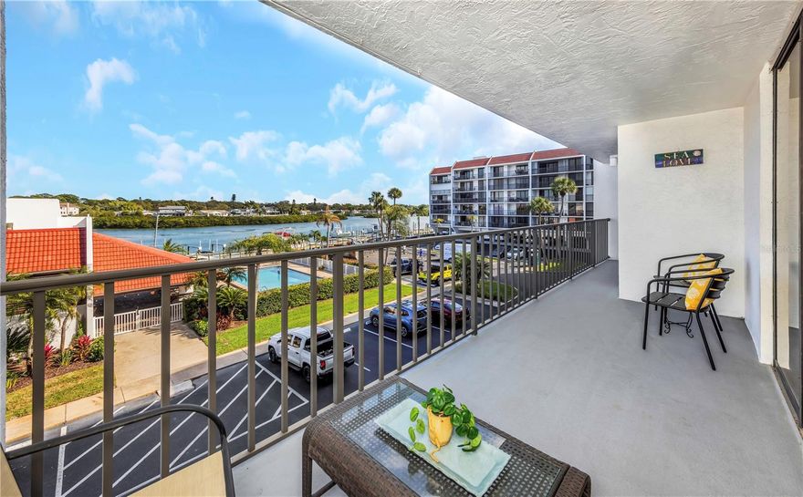 Welcome to Vista Bay—where every day feels like a vacation. Perfectly positioned on the Intracoastal and just steps from the Gulf’s sugar-white beaches, this residence delivers the ultimate blend of boating and beachside living. Enjoy endless water views by day and stunning sunsets by night—all from home.

This fully furnished unit showcases sweeping, unobstructed Intracoastal views, along with a private deeded boat slip with electric and an assigned parking space—an unbeatable combination for waterfront living. Inside, the bright open-concept design is both inviting and functional, with sliding glass doors throughout that lead to two balconies, including a west-facing screened balcony made for sunset watching and evening breezes.

The primary suite offers a peaceful retreat with water views, a spacious California-style closet, and an updated ensuite bath. The guest bedroom features a built-in Murphy bed and access to a beautifully updated, spa-like bathroom—ideal for visitors.

The sleek kitchen is designed to impress with quartz countertops, stainless steel appliances, a breakfast bar, and a large island that flows effortlessly into the living and dining areas. Additional highlights include in-unit laundry, new water heater, newer HVAC, new range, new storm door, and a shared exterior storage closet.

Residents enjoy resort-style amenities including a heated waterfront pool, tennis and pickleball courts, grilling areas, shuffleboard, a car wash station, and a private dock with overnight boat parking. All just minutes from local dining, shopping, Clearwater Beach, Tampa International Airport, and downtown St. Petersburg.