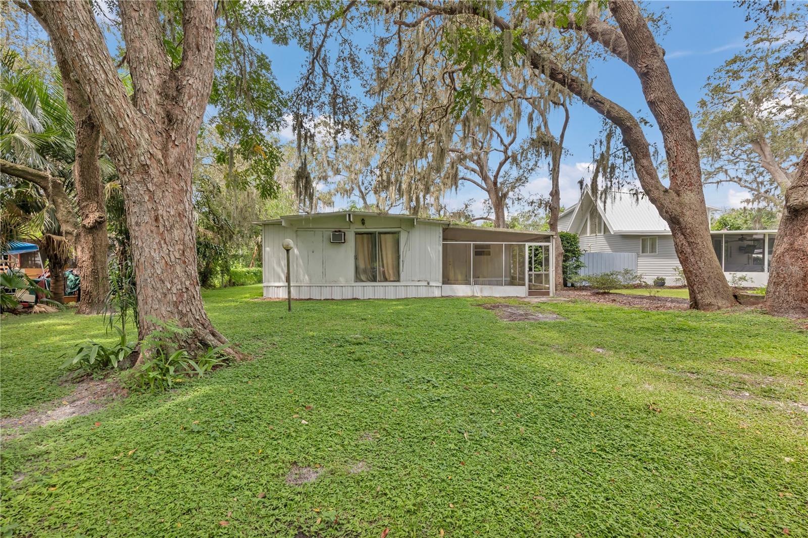 Private gated community, located in scenic Odessa Florida. Some of Odessa's first residents lived here in The Holiday Club. One of the three big Lumber Mills that Made this area popular with investors was located right here. The Mill owner would drive his Model T with the wheels switched out would ride to Tampa for Supplies eventually bring back local Tampa Residents out for the first of many weekend getaway lake houses that make Keystone and Odessa so popular with those finding success in the big city looking to get away to the country and enjoy life. This cozy 2 bedroom 1 bath needs some TLC but will make a great home for someone looking to get out on the Lake and Slow down a bit. Located in a native Live Oak Forest, the Private shaded streets have a 10 MPH speed limit as they meander through growths of old Oak century trees. The multi-acre park located on beautiful Lake Parker offers residents and their guests shady grassed areas under rustling cypress trees for picnics. The park features a Volleyball Court, fishing Dock, Boat Ramp, swimming area and Horseshoe Pits. Beautiful Lake Anne Awaits We also have a fully equipped and fenced Playground and park for our younger residents to enjoy in safety. HOLIDAY CLUB is a Neighborhood Watch Community and has an active safety and reporting network to keep our community a safe place to live and play.